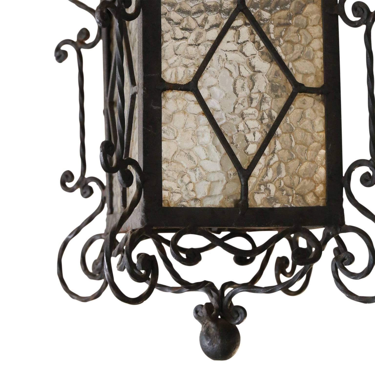 Single-light vintage black-painted wrought iron lantern from Spain.