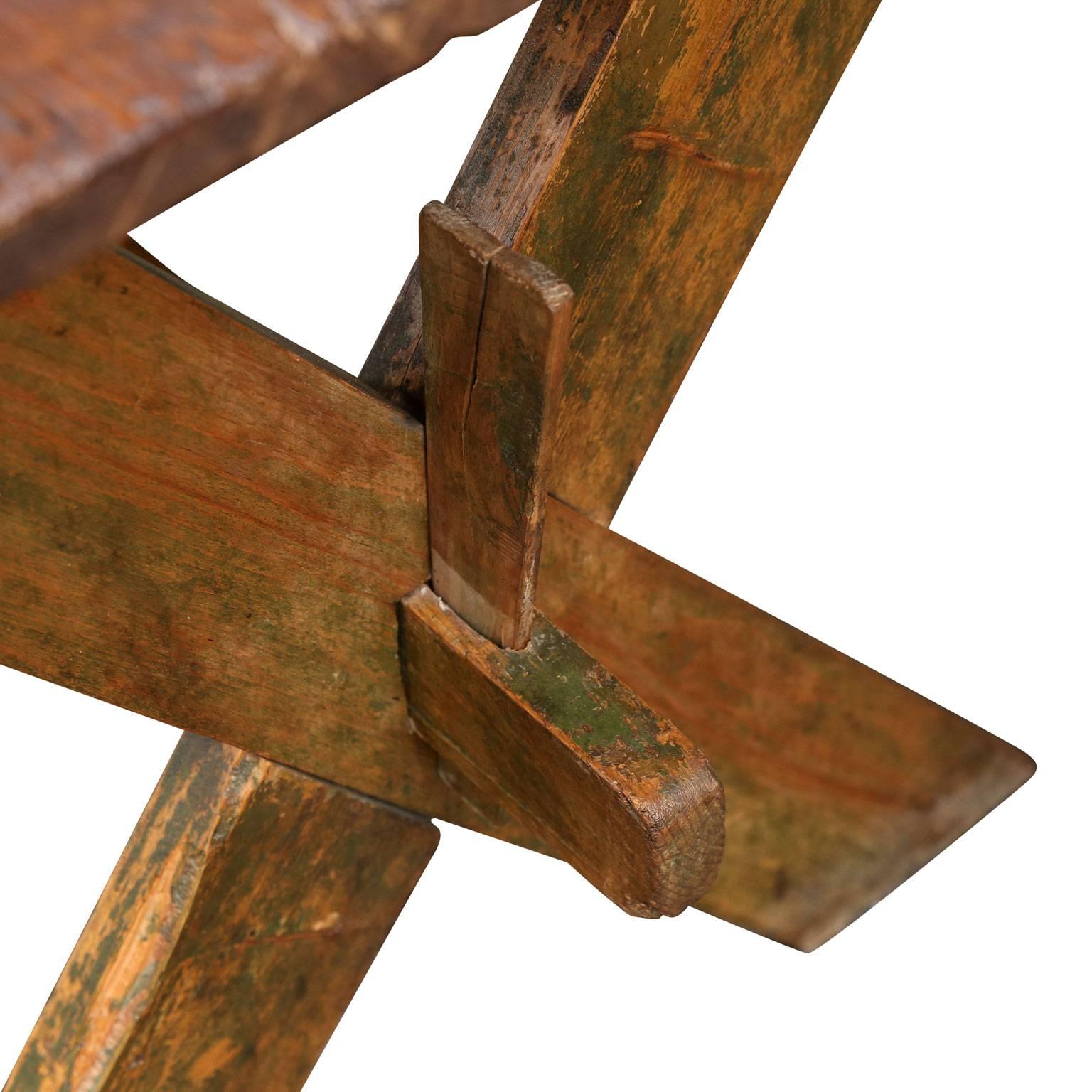 French green-painted work table (circa 1890-1920) raised upon trestle base. Features two drawers on opposite sides and remnants of early green paint. Perfect for a desk.
 