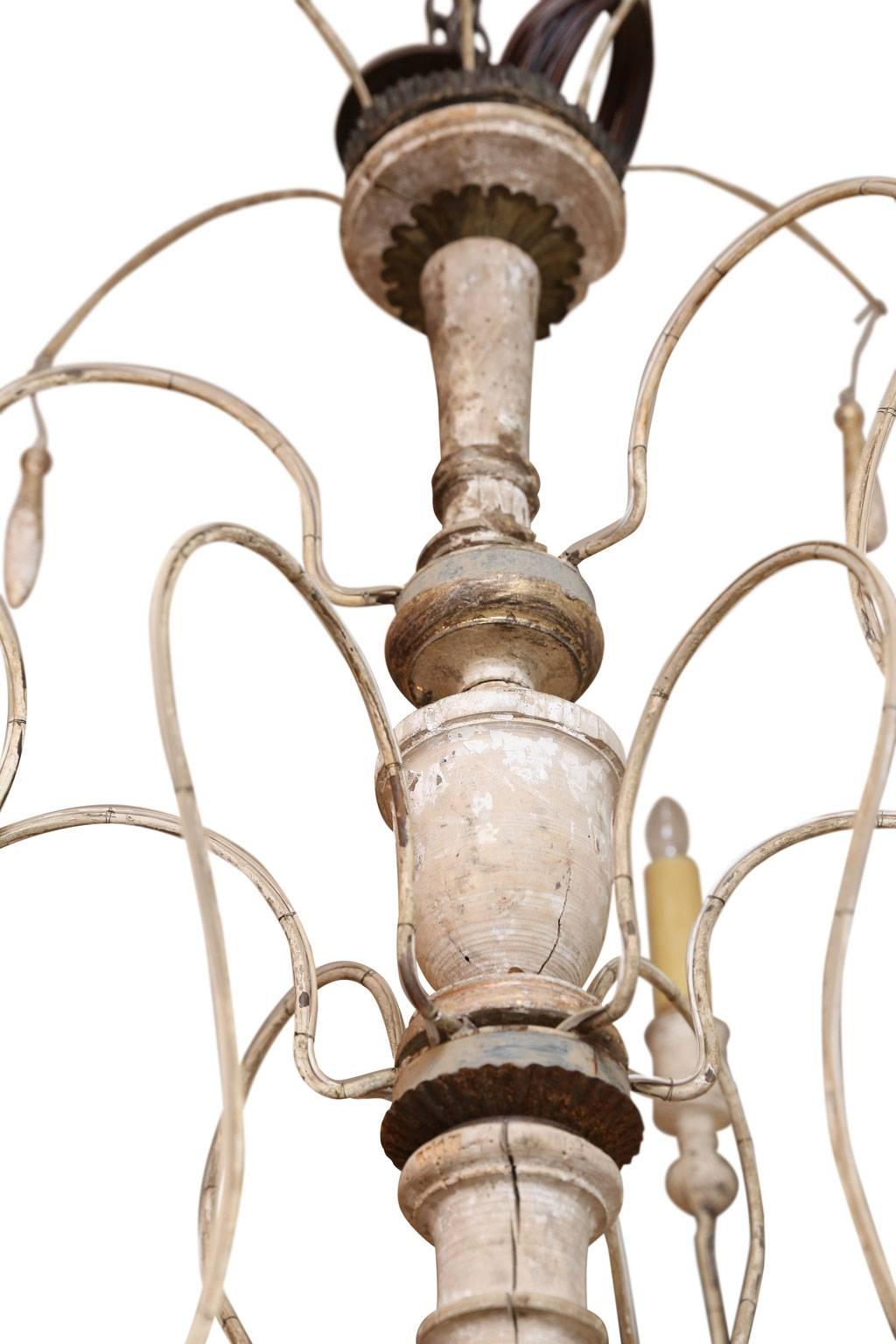 Two-tier nine-arm iron and wood chandelier, with giltwood details, created from 18th century French elements. Newly wired with chain and a canopy.