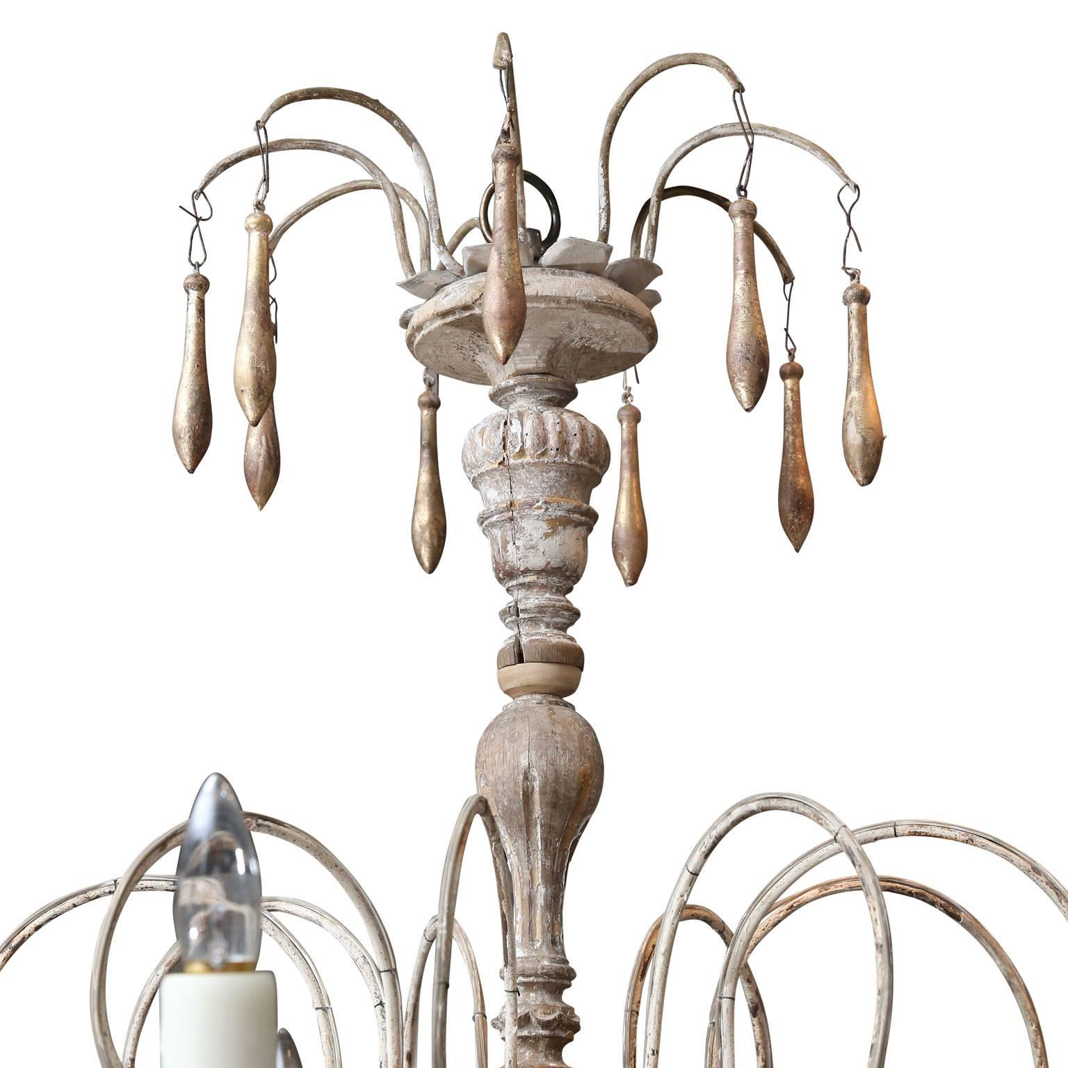 Eight-arm iron and wood chandelier, with giltwood decoration, created from 18th century French elements. Newly wired with chain and a canopy.