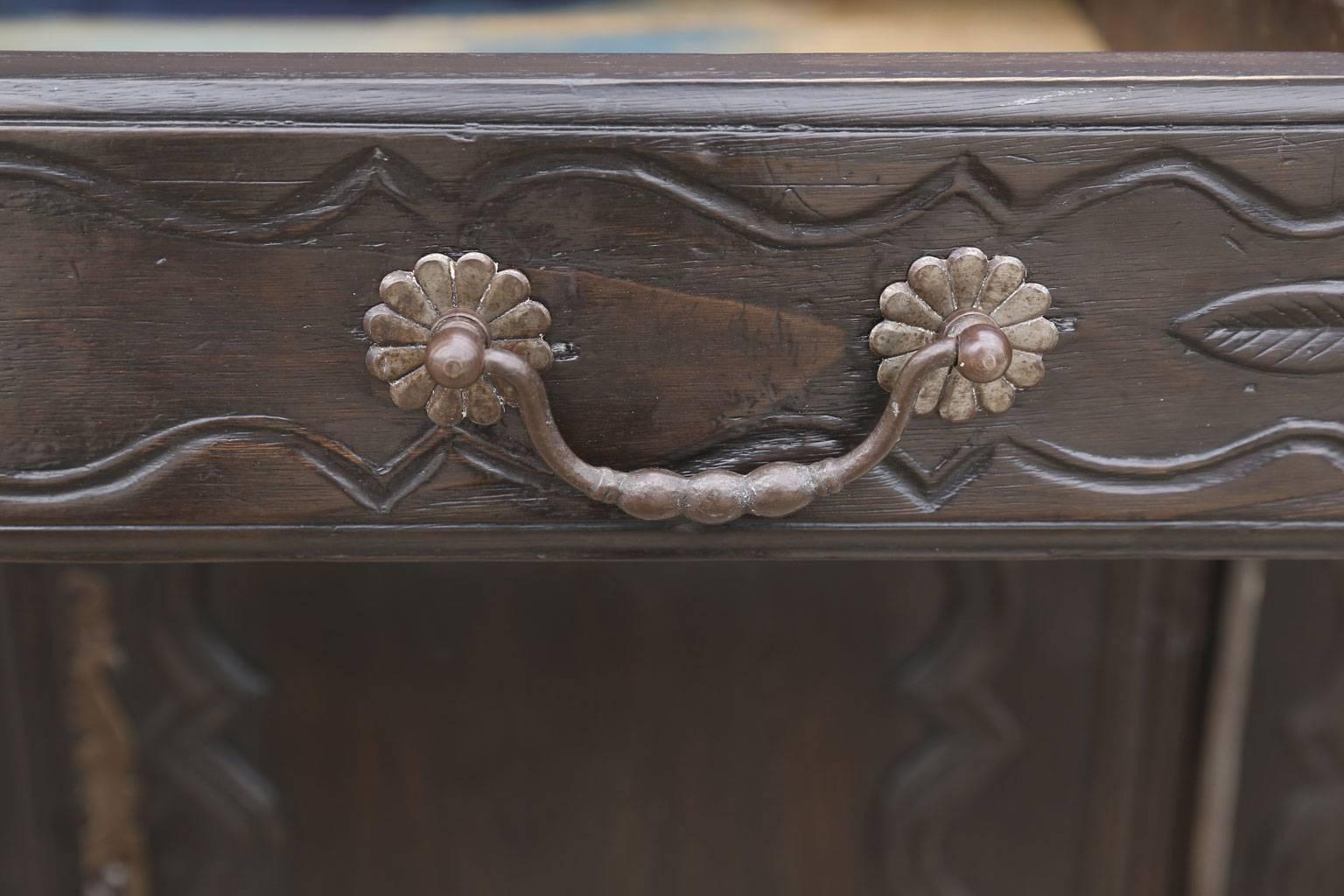 Dark brown oak French buffet, two doors, one-drawer and single interior shelf. Dated to the mid-18th century and probably from Northern France. Includes working lock and key.
