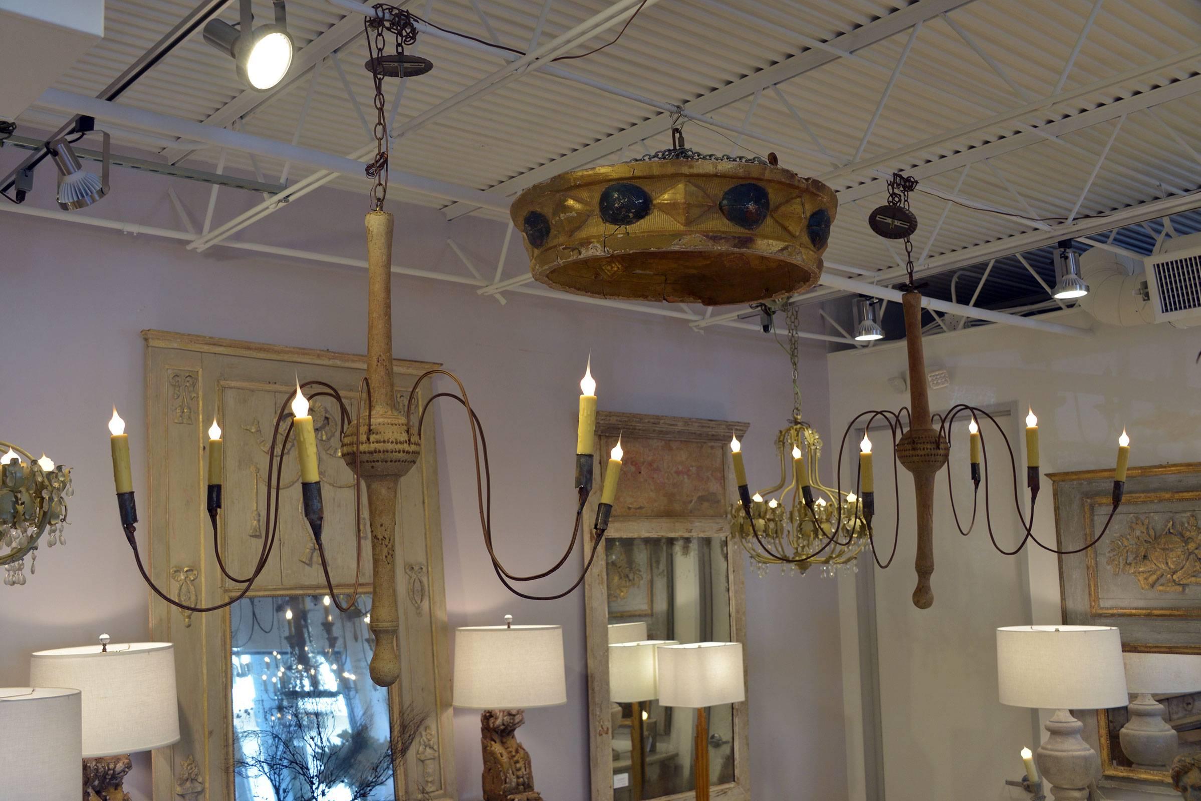 Rare pair of elegant 18th century Swedish chandeliers newly wired with chain and canopies, but otherwise in completely original condition. Each chandelier features a turned body of natural wood with an exquisite patina, simple decoration and six
