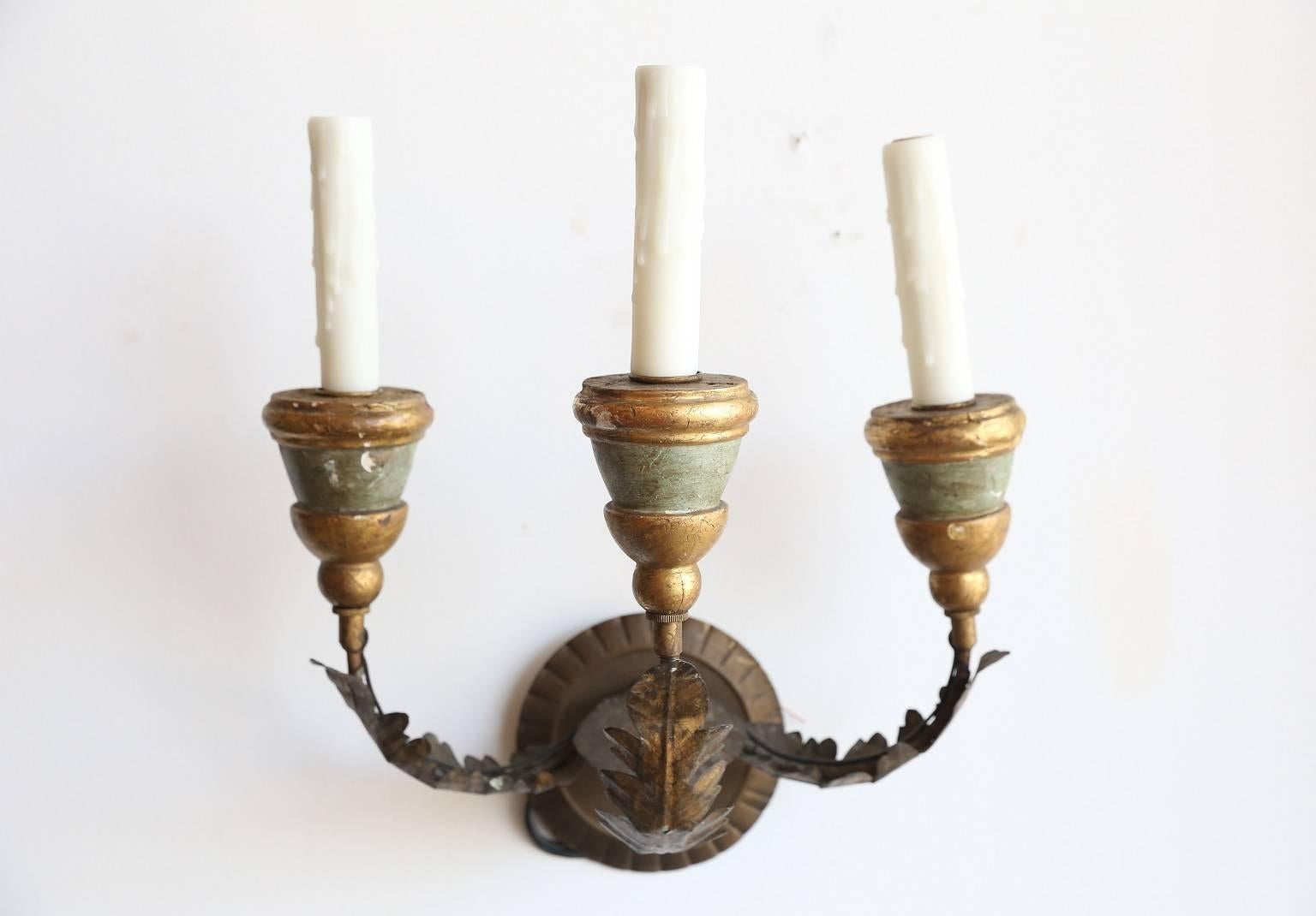 Pair of 19th century newly-wired three-arm sconces with acanthus decoration, painted wooden bobeches with gilt detail and new back plates.
