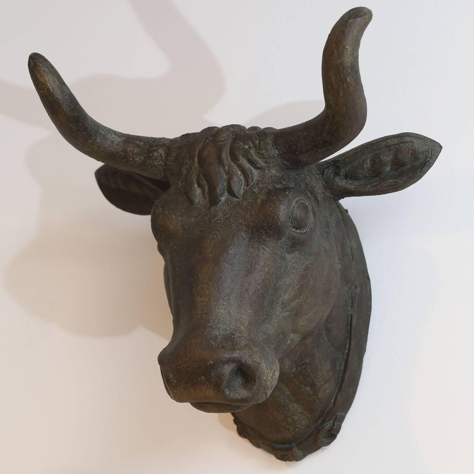 French vintage metal cow head with a dark rich patina and subtle traces of gilt.