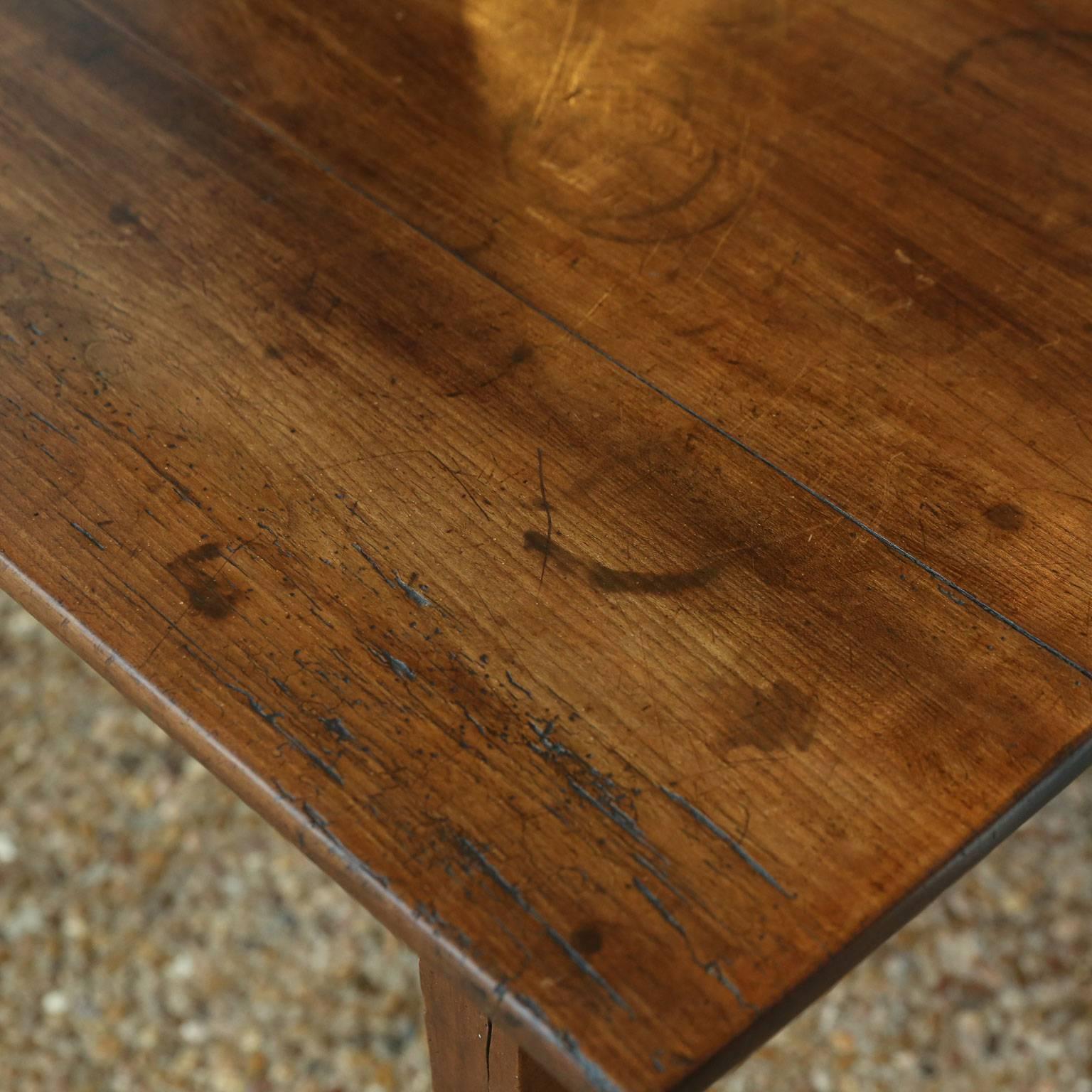 18th century Italian provincial cherry table with pegged joined, taper-shape legs and a good patina with excellent mottled color and fading.