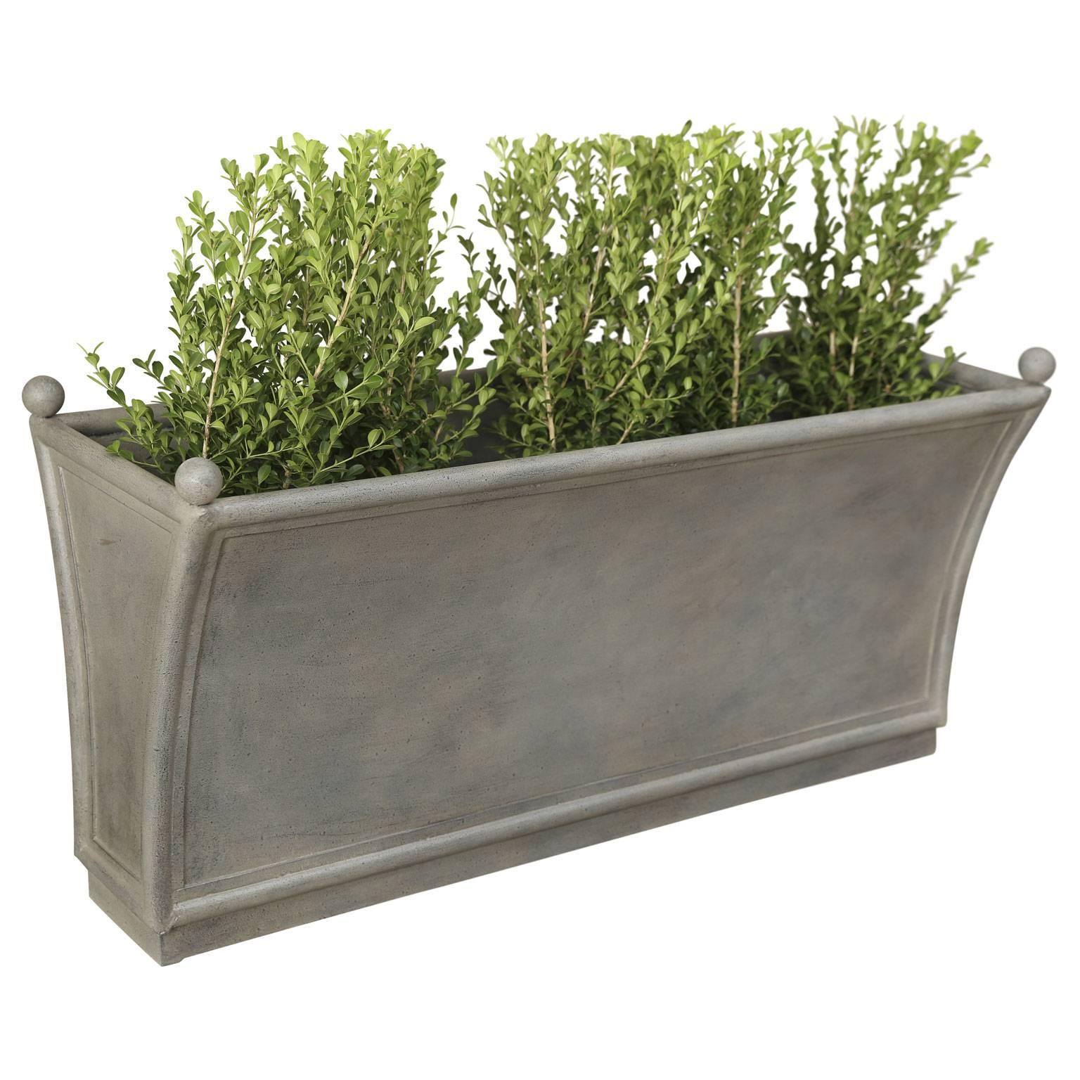 Two French style long metal planters. Priced individually.