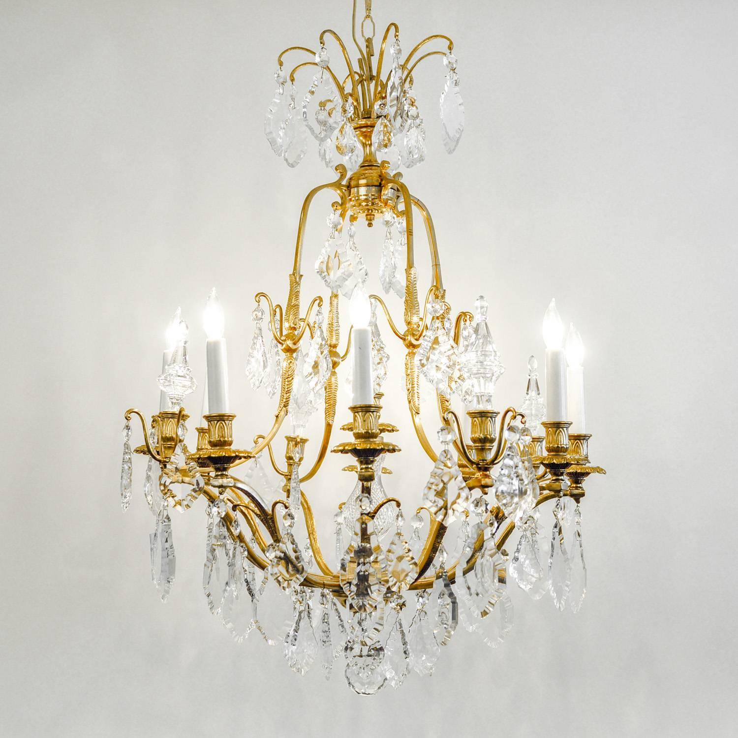 Antique French cut crystal eight arms brass frame chandelier. Excellent working condition, rewired for US use. The chandelier measure 36 inches Length from the base to the top of the brass frame. 32 inches diameter. 