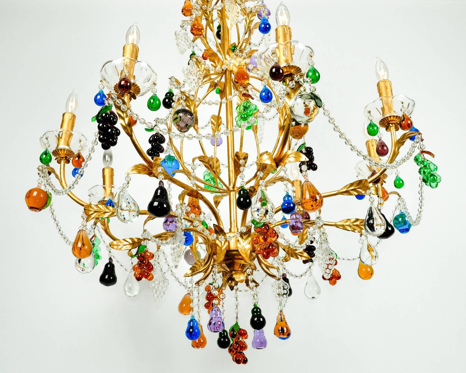 Vintage Venetian crystal fruits design details chandelier with gilded brass frame. Excellent working condition. Rewired for us use. The chandelier measure 33 inches high from base to the top brass frame. 30 inches body diameter. High may be vary