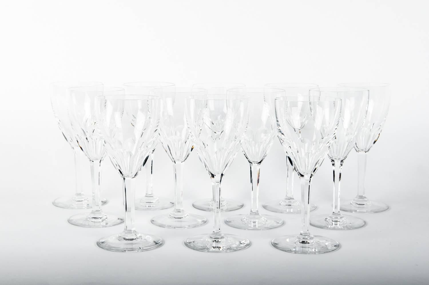 Baccarat crystal set of 12 wine / water glassware. Excellent condition. Maker's mark undersigned. Each wine / water glass measure 7.5 inches high x 4.2 inches top diameter.