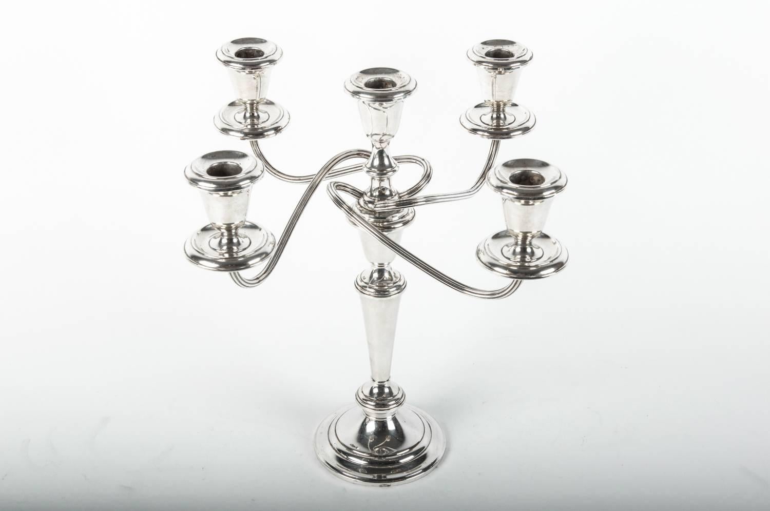 Vintage sterling silver five arms candelabra. Also can be use as a single candlestick. The candelabra is in excellent vintage condition , maker's mark undersigned . The candelabra measure 13 inches high x 13 inches top diameter.