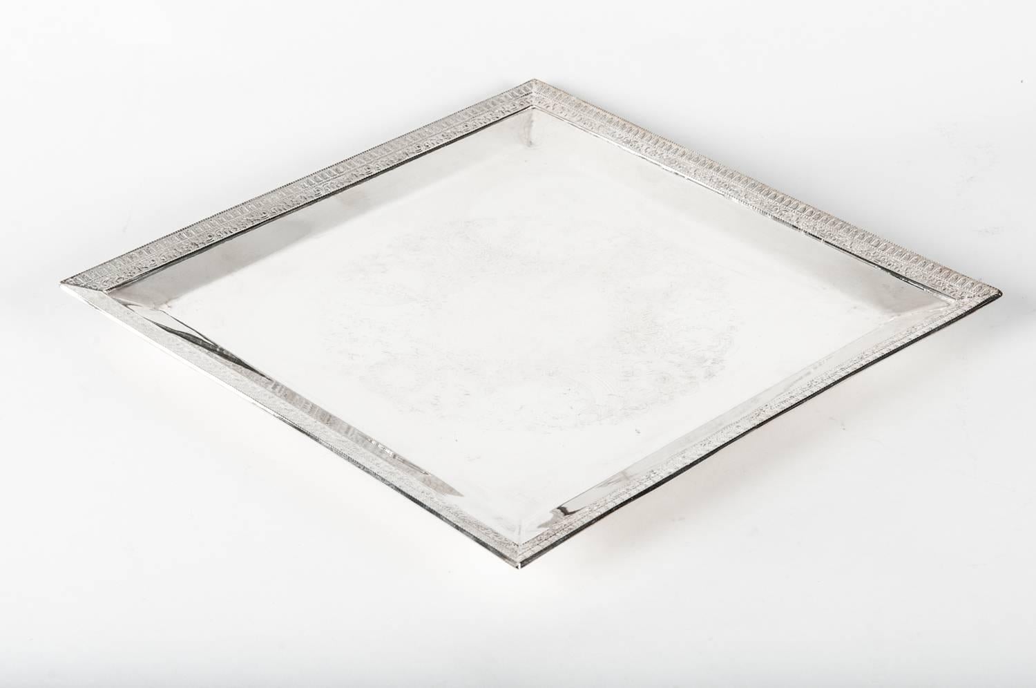 Vintage English Sheffield footed square shape silver plate barware  / serving tray. The barware /serving tray is in excellent vintage condition , maker's mark undersigned . The tray measure 12inches X 12 inches .
 