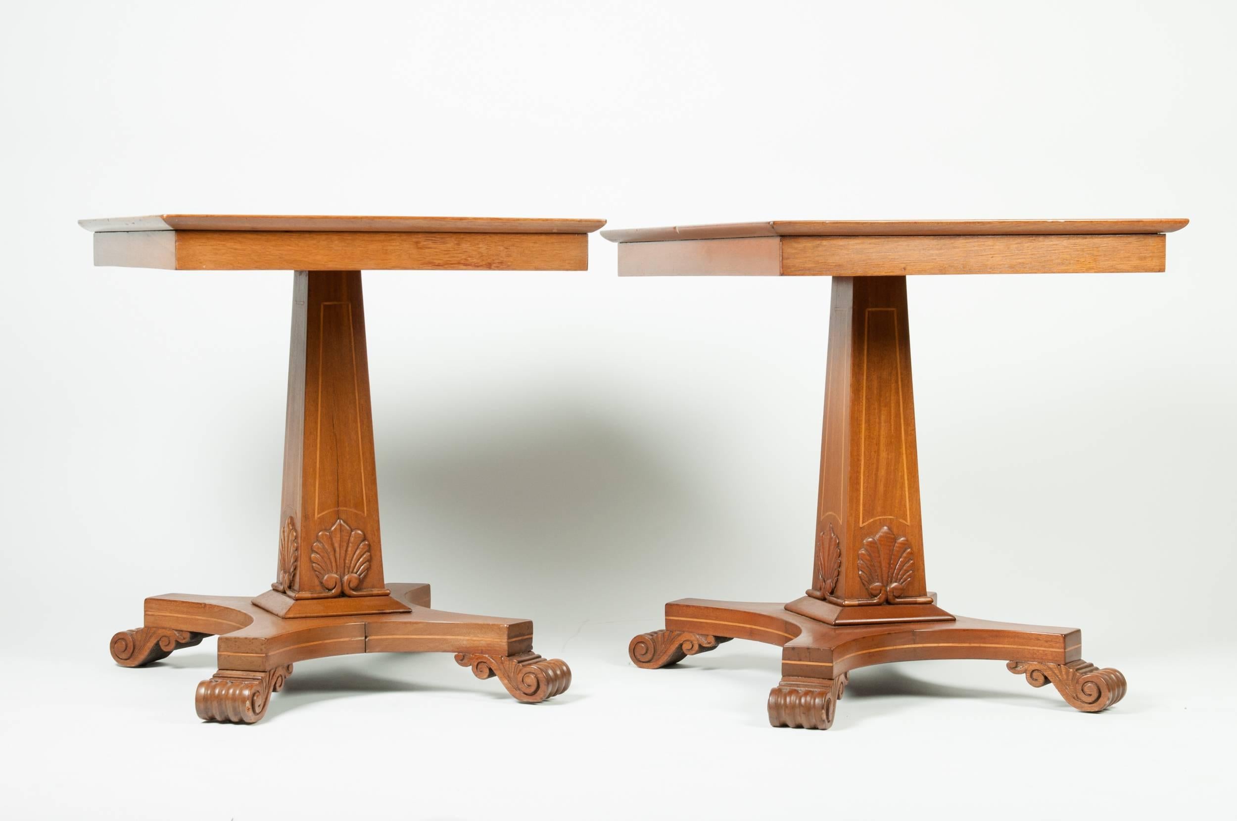 An antique pair of square light mahogany wood end or side tables. Each table is in great sturdy  antique condition with minor wear consistent to age / use . Each side table measure 28 inches long x 23 inches width x 26 inches high.