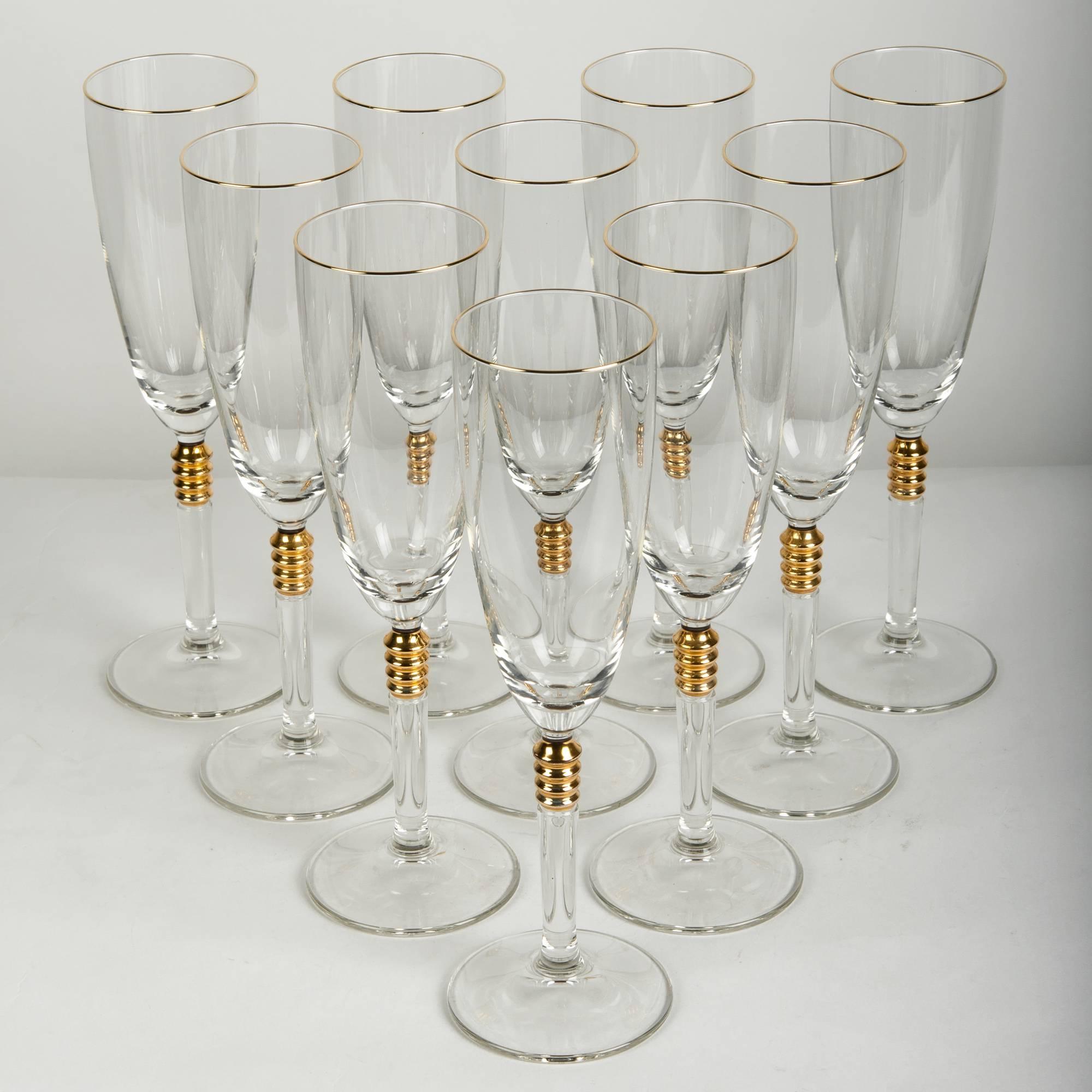 Vintage crystal with gold design details set of twelve champagne / drinks glassware. Each glass is in excellent vintage condition. Just exquisite. Each one measure about 9.3 inches high x 2.5 inches diameter.