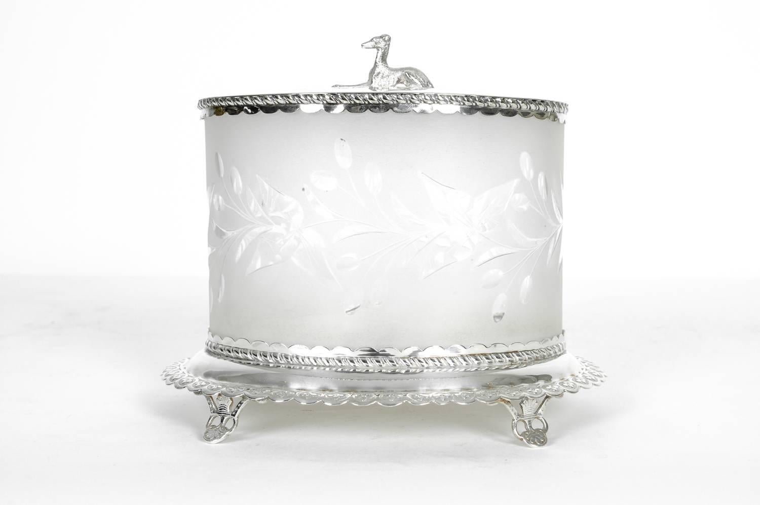 Antique English oval form cut crystal with silver plated footed holding base carrier covered top with dog sculpture design details ice bucket / thin biscuit. The piece is in excellent antique condition maker's mark undersigned. The piece measure 7.3