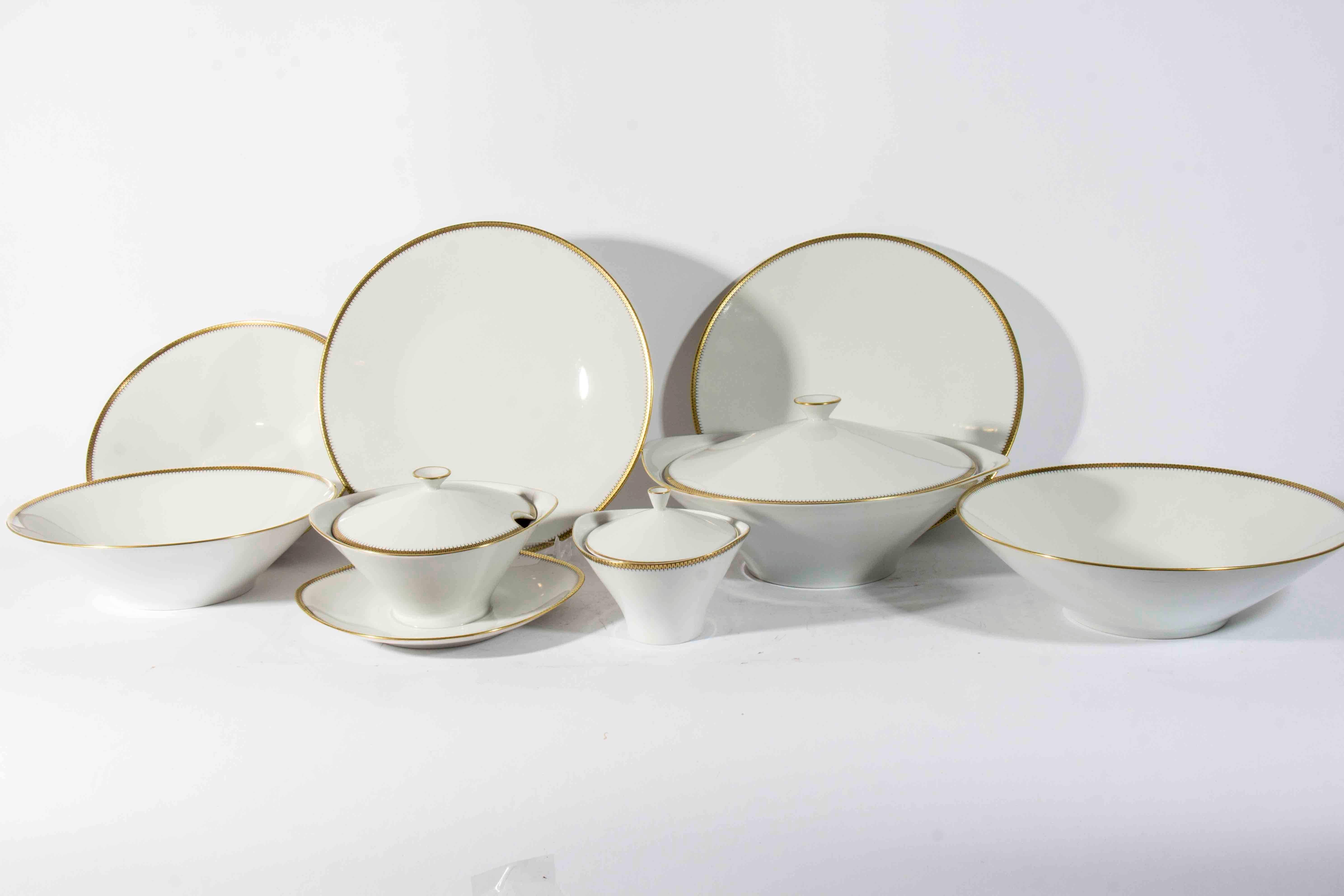 Vintage Bavarian dinnerware service for 12 with extras and serve ware. White porcelain with gold detail on rim. All pieces in excellent condition. 

Includes:

12 dinner plates
12 salad plates
12 bread and butter plates
12 desert plates
12