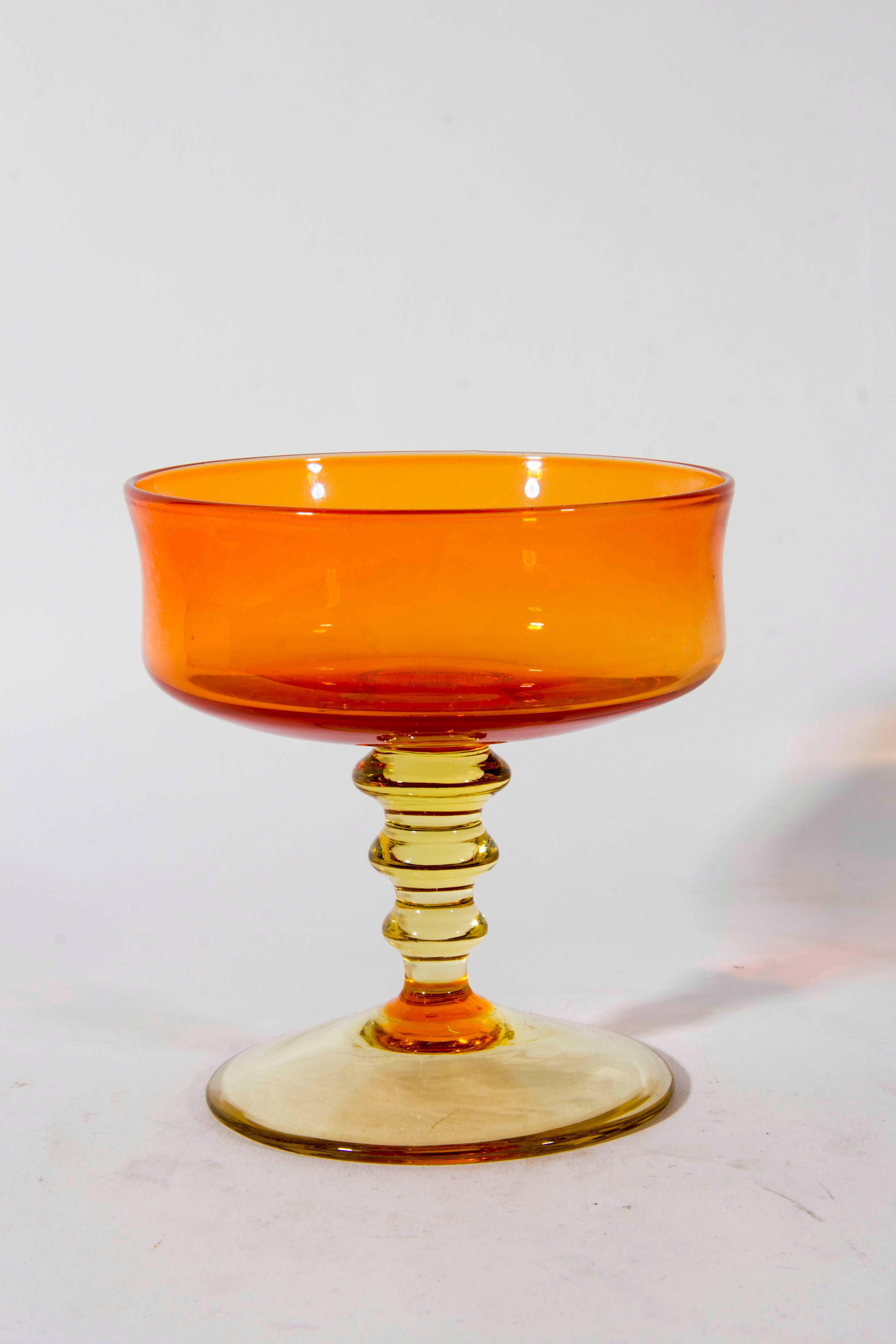 Vintage set of handblown orange with amber stem champagne coupe or ice cream / sorbet. Excellent condition. The champagne measure 4.5 inches high x 4 inches diameter.