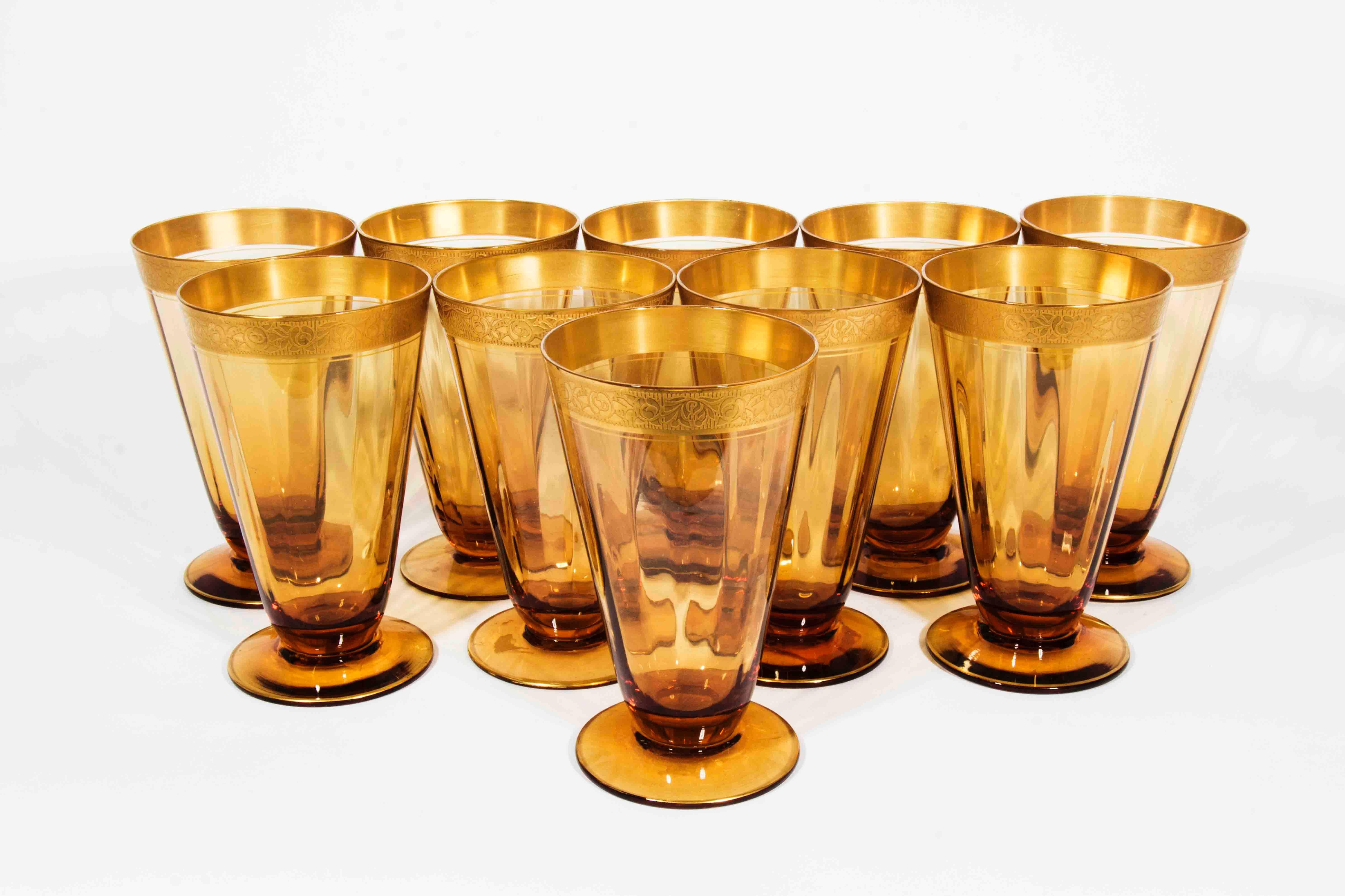 Vintage set of amber crystal water/drinks glasses with gold designed ban. Excellent condition. The glass measure 5.5 inches high X 3 inches diameter.