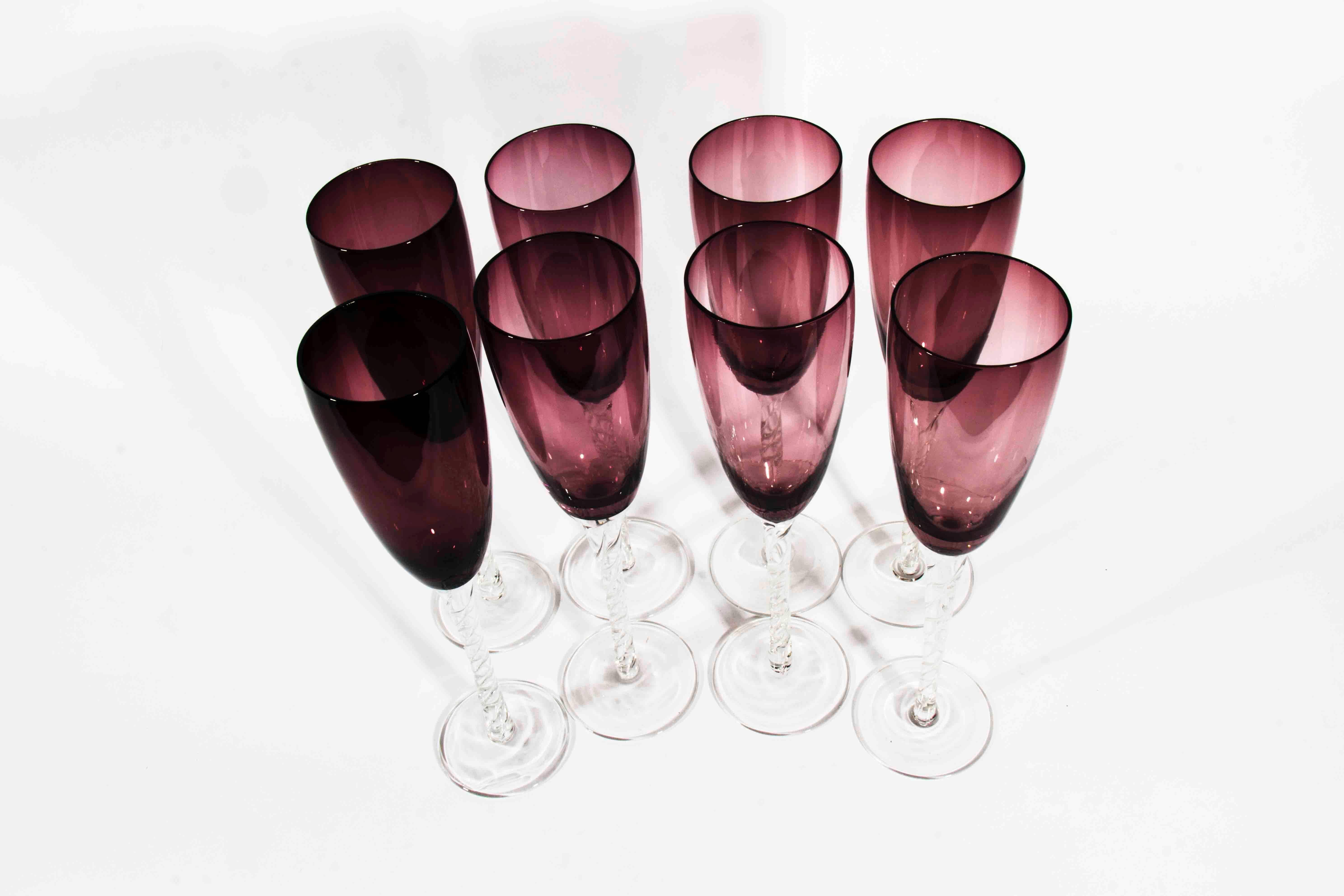 Twelve vintage amethyst crystal champagne flutes with clear stem excellent condition. Each glass measure 10 inches high x 2.5 inches diameter.