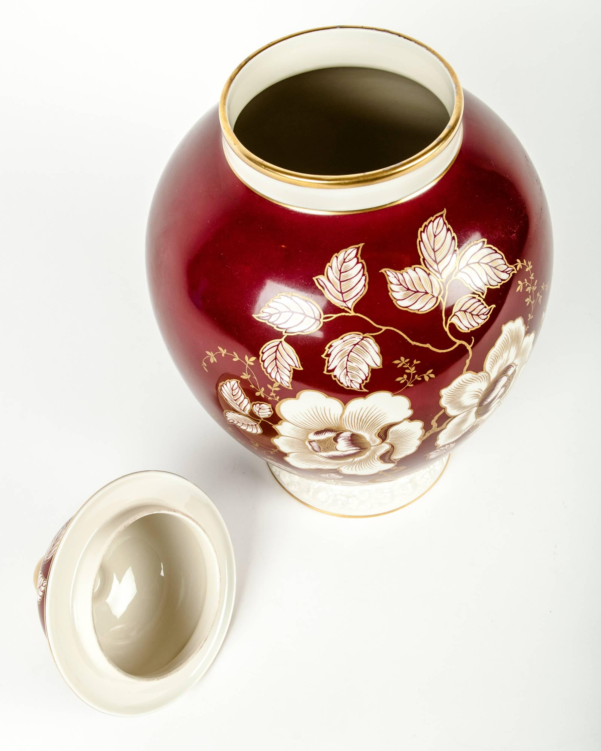 Vintage German decorative porcelain urn. The porcelain urn measure 16 inches high X 10 inches diameter.