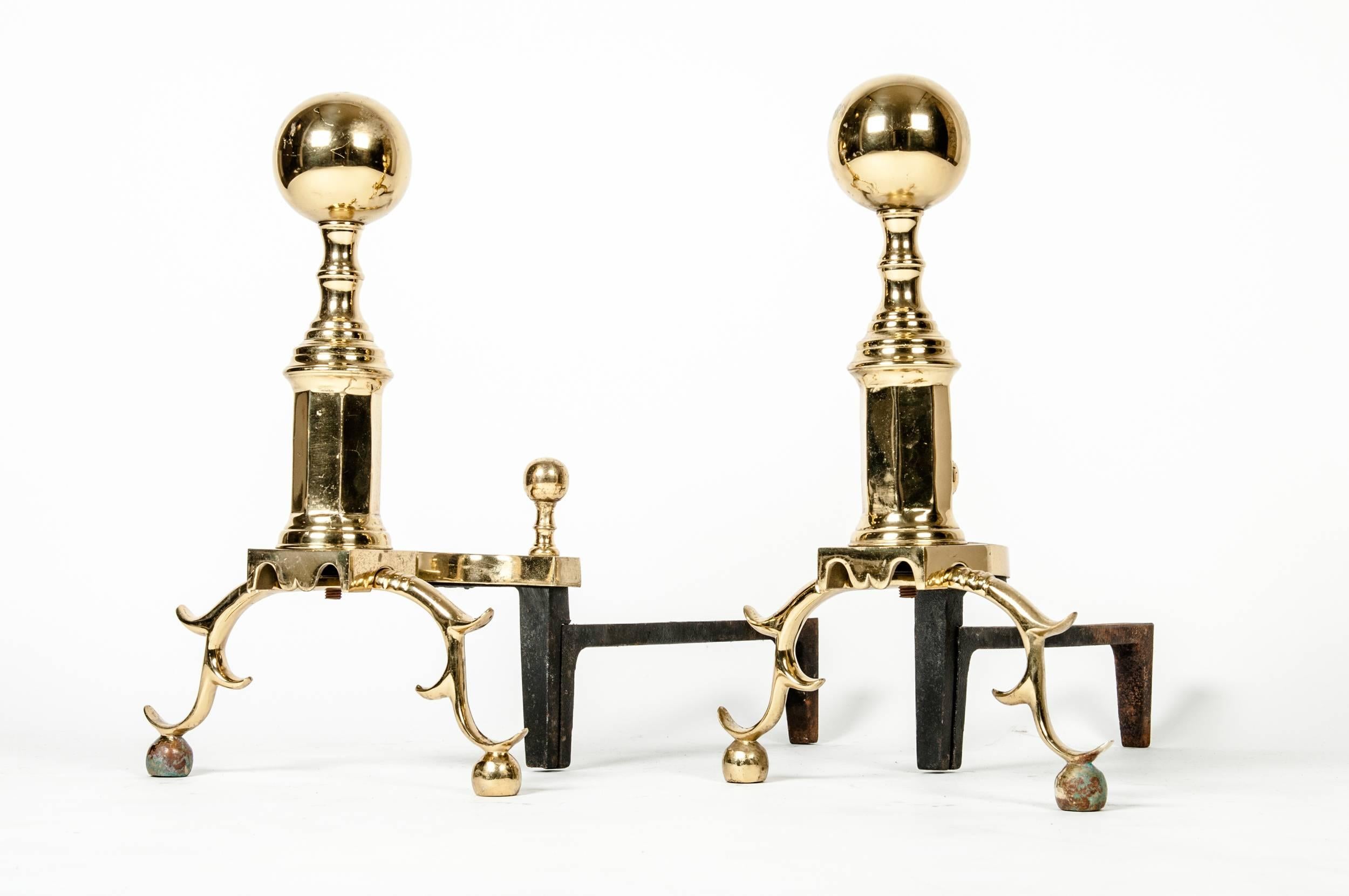 Vintage solid brass andirons. The andiron measure 18 inches high x 22 inches long.