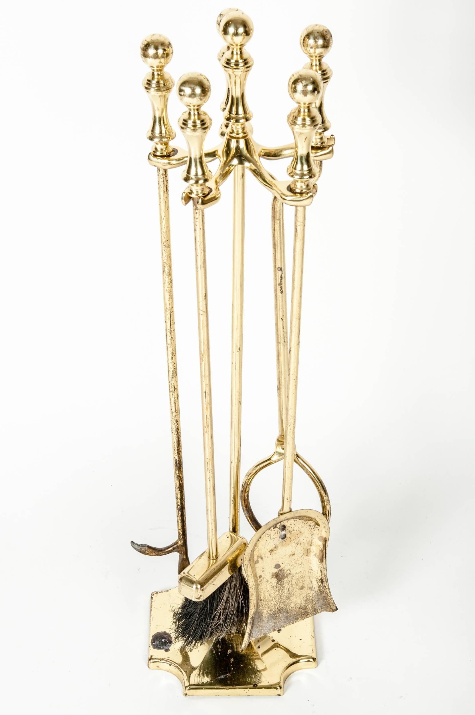 Vintage solid brass fire tool set. The fire tool measure 34 inches high x 8.5 inches diameter.