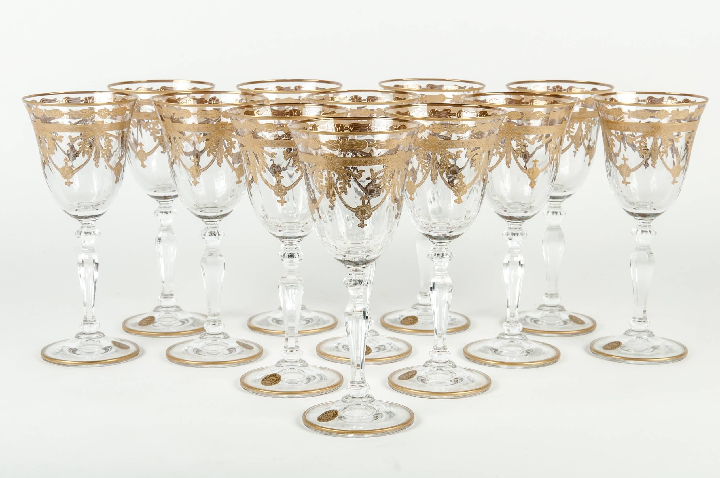 Set of 12 Murano champagne flute with 24-karat gold design. Each champagne flute measure 8.5 inches high x 2.5 inches diameter.