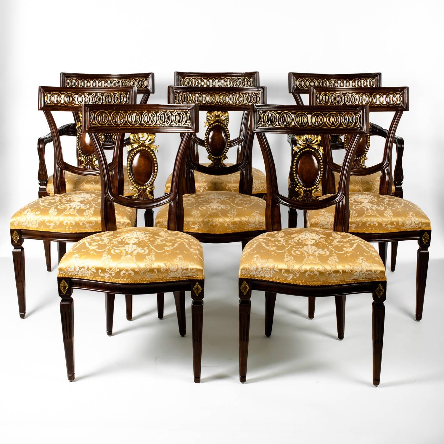 A vintage set of eight European mahogany wood dining chairs. Six side chairs and two armchairs. Excellent condition. Each dining chair measure 35 inches high x 19 inches length x 17 inches width.