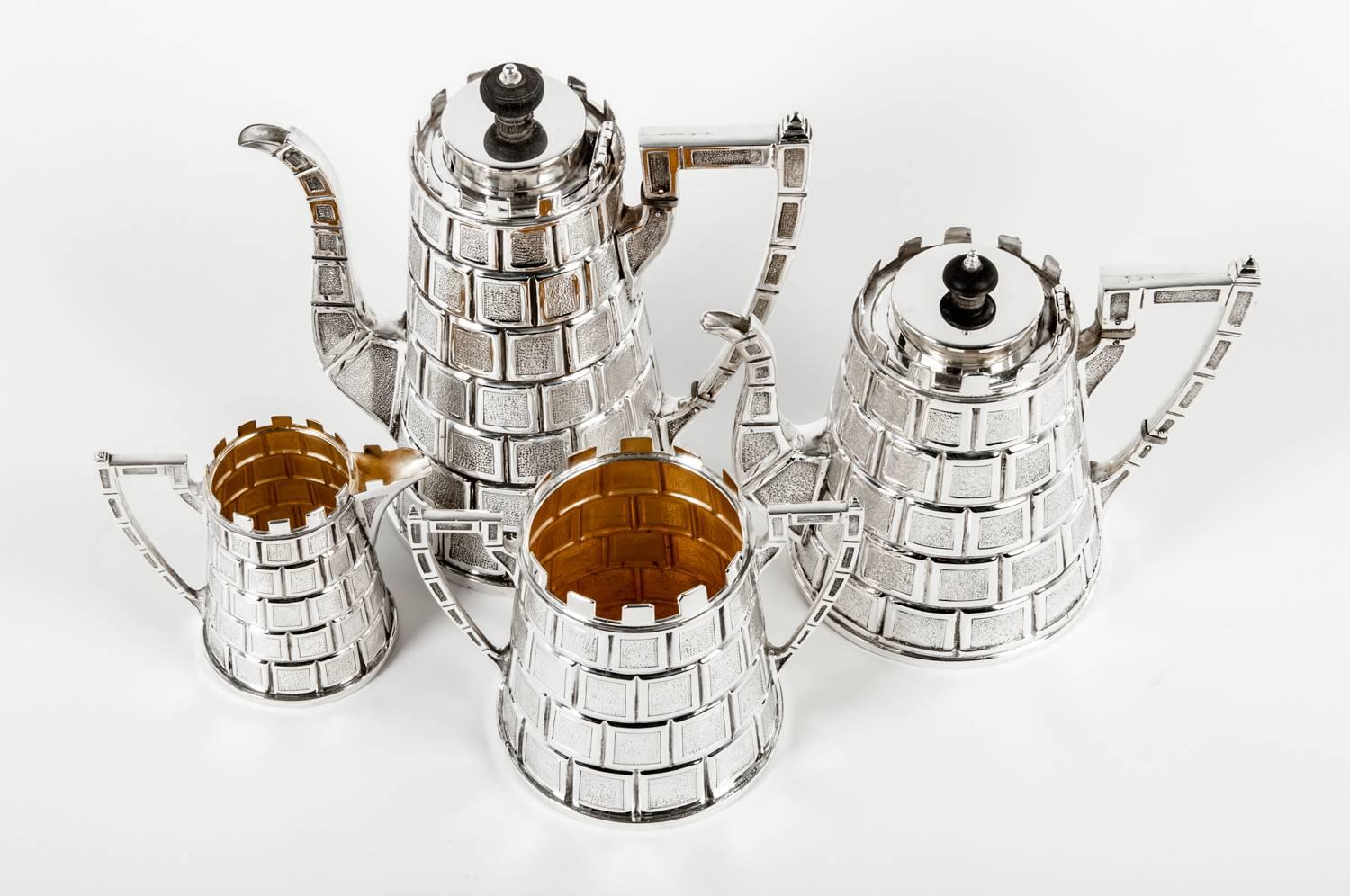 Antique English silver plate four-piece tea and coffee set. The creamer and sugar / tea bags dispenser is 24-karat gold wash. The tea pot is 7 inches high x 8.5 inches diameter. The coffee pot is 10 inches high x 9 inches diameter. The sugar pot is