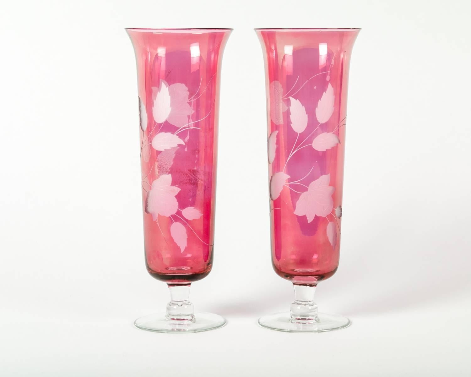 Vintage etched crystal cranberry pair of decorative vases with clear stem. Each one measure 14 inches high x 5 inches diameter. Excellent condition.