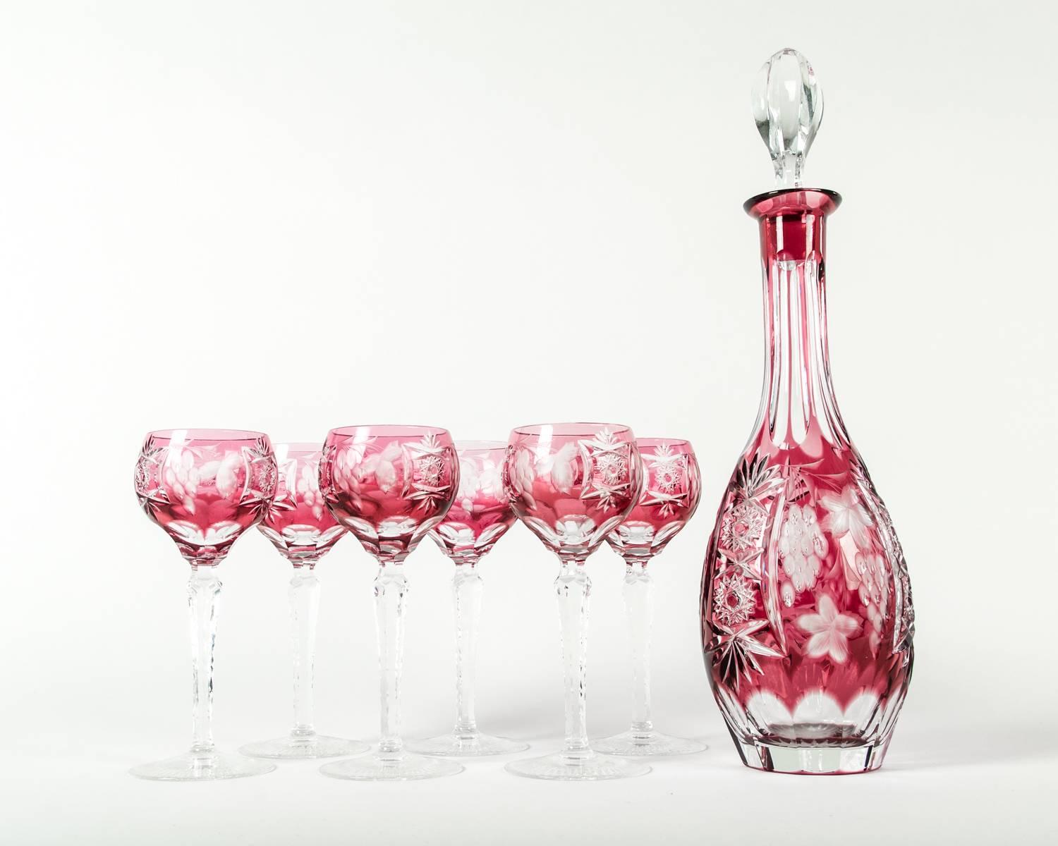 Antique Baccarat cut crystal cranberry wine decanter set. The set include six wine glasses and decanter. Excellent condition. Each glass measure 8 inches high x 3 inches diameter. The decanter measure 12 inches high x 3 inches diameter.