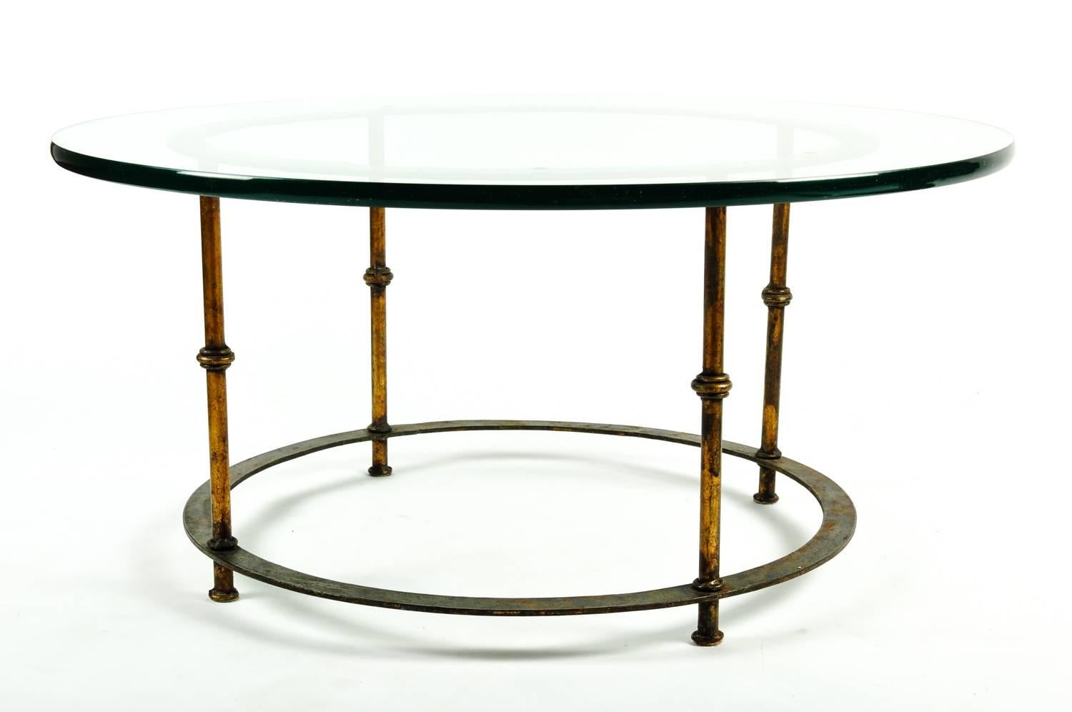 Mid-Century round brass table with detachable heavy glass top. The round table measure 19 inches high x 34 inches diameter. Excellent condition.
