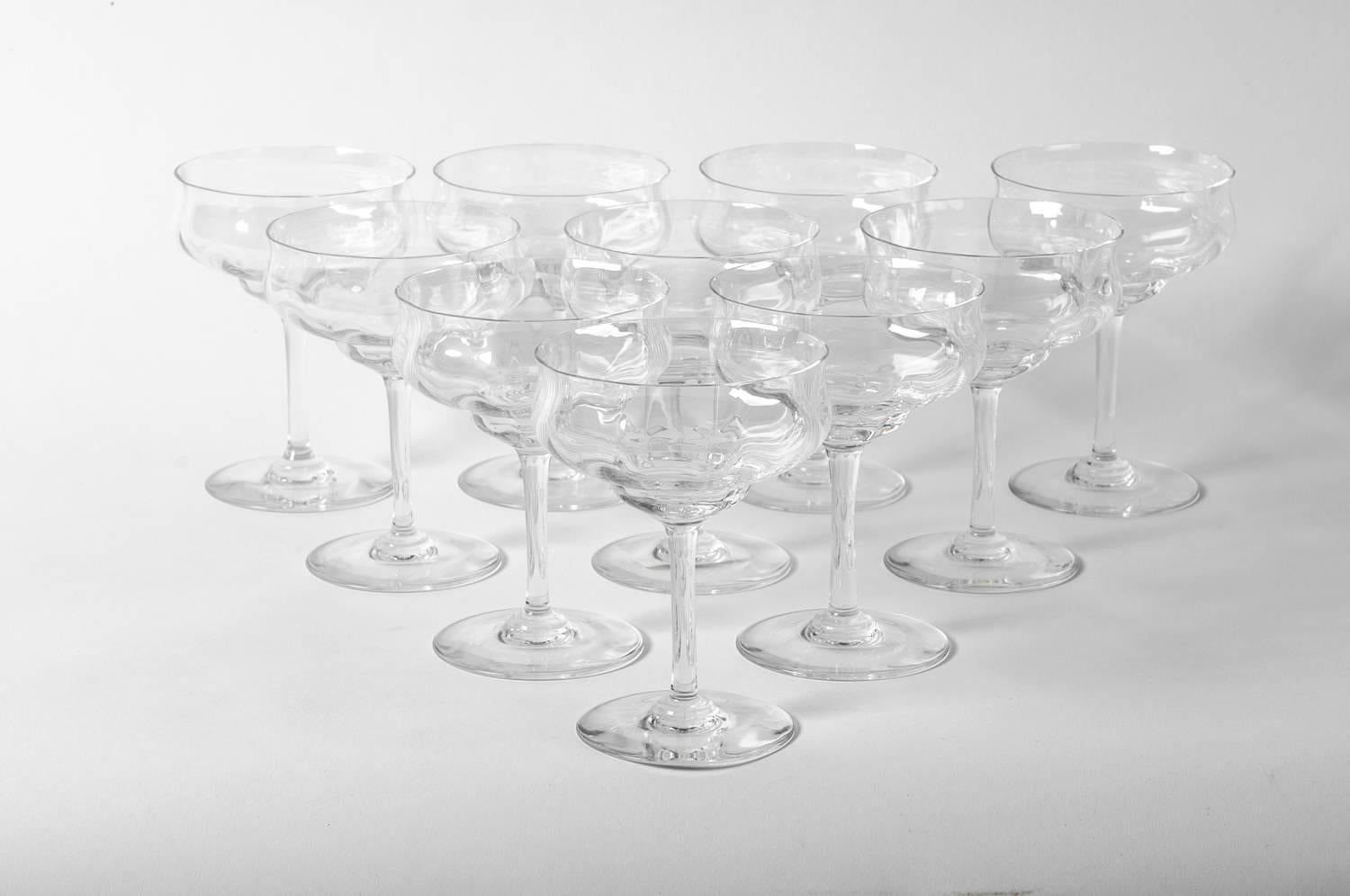 Vintage set of eight Baccarat champagne or drinks crystal coupe. Excellent condition. Each coupe measure 5.5 inches high x 4 inches top diameter.