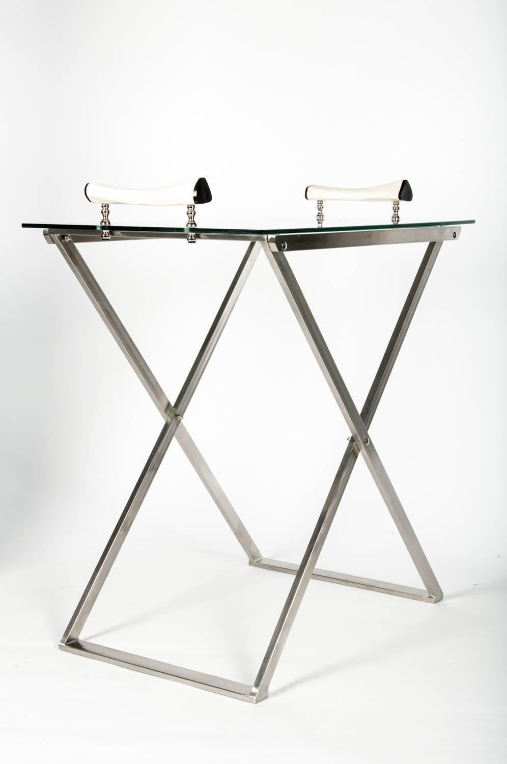 Mid-Century Modern foldable bar cart with detachable glass top tray. The bar cart stand 33 inches high x 30 inches long x 20 inches width.