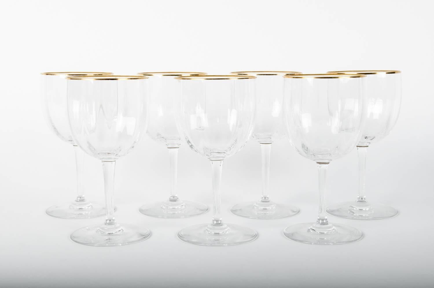 Vintage Baccarat set of seven red wine or water glasses with gold trimmed top. Excellent condition . Each glass has the maker's mark on the base. Each one measure 7 inches high x 3.5 inches top diameter.