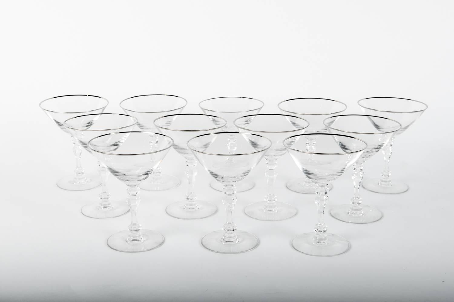 Vintage set of 8 crystal champagne coupes or martini or cocktail with platinum trimmed top. Excellent condition. Each coupe measure 5.5 inches high x 4.2 inches top diameter.