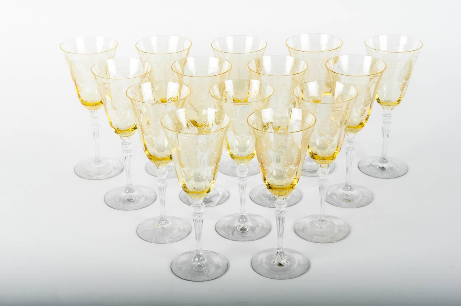 Vintage set of 12 yellow crystal wine or water glasses with etched design. Excellent condition. Each glass measure 8.5 inches tall x 3.6 inches top diameter.