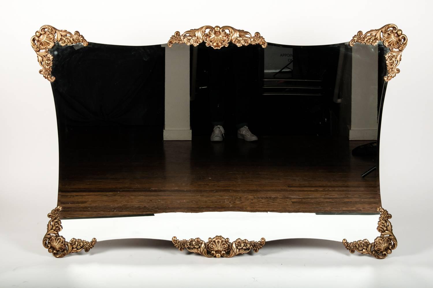 Mid-Century hanging wall or fireplace mental mirror. This mirror is in excellent condition and would bring a great addition to any space. The mirror measure 56 inches length x 37 inches width.