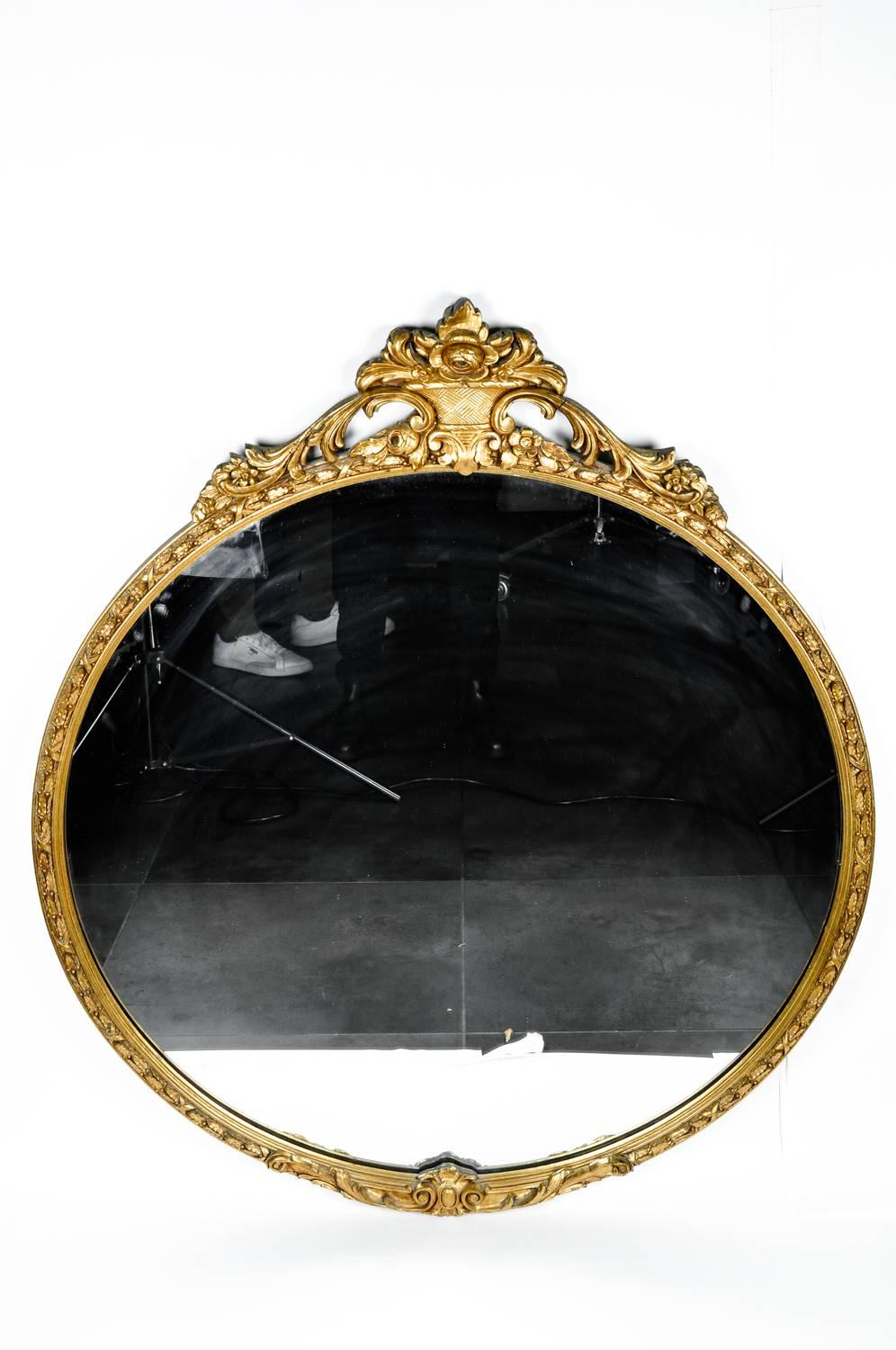 Antique giltwood frame mantel / fireplace hanging wall mirror. In excellent condition. The hanging mirror measure 44.5 inches in diameter.