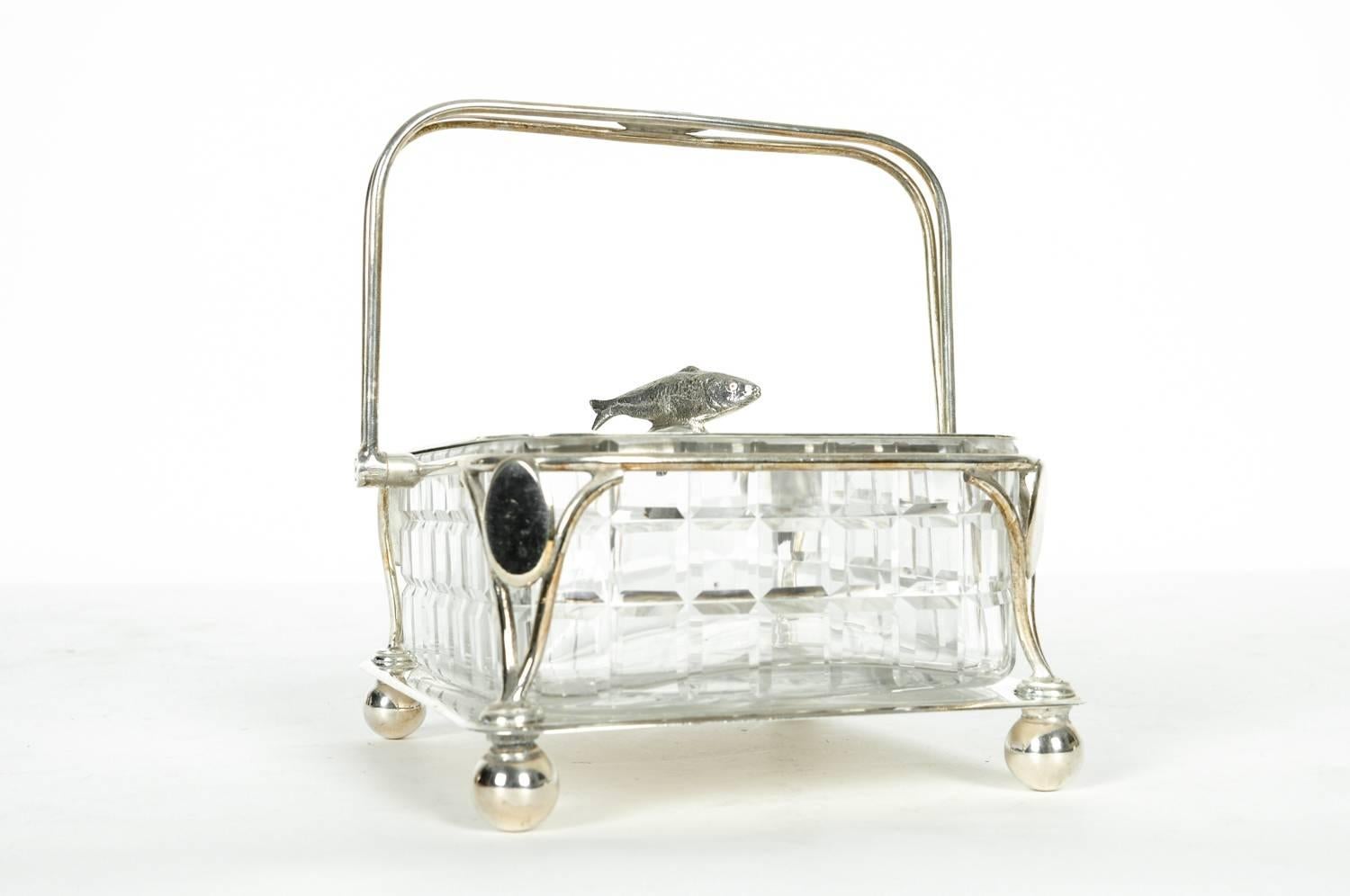 Old English silver plated holding carrier with cut crystal caviar dish. All in excellent condition. The caviar holding carrier measure 6 inches X 6 inches X 6 inches. The cut crystal caviar dish measure 5.3 inches X 4.5 inches.