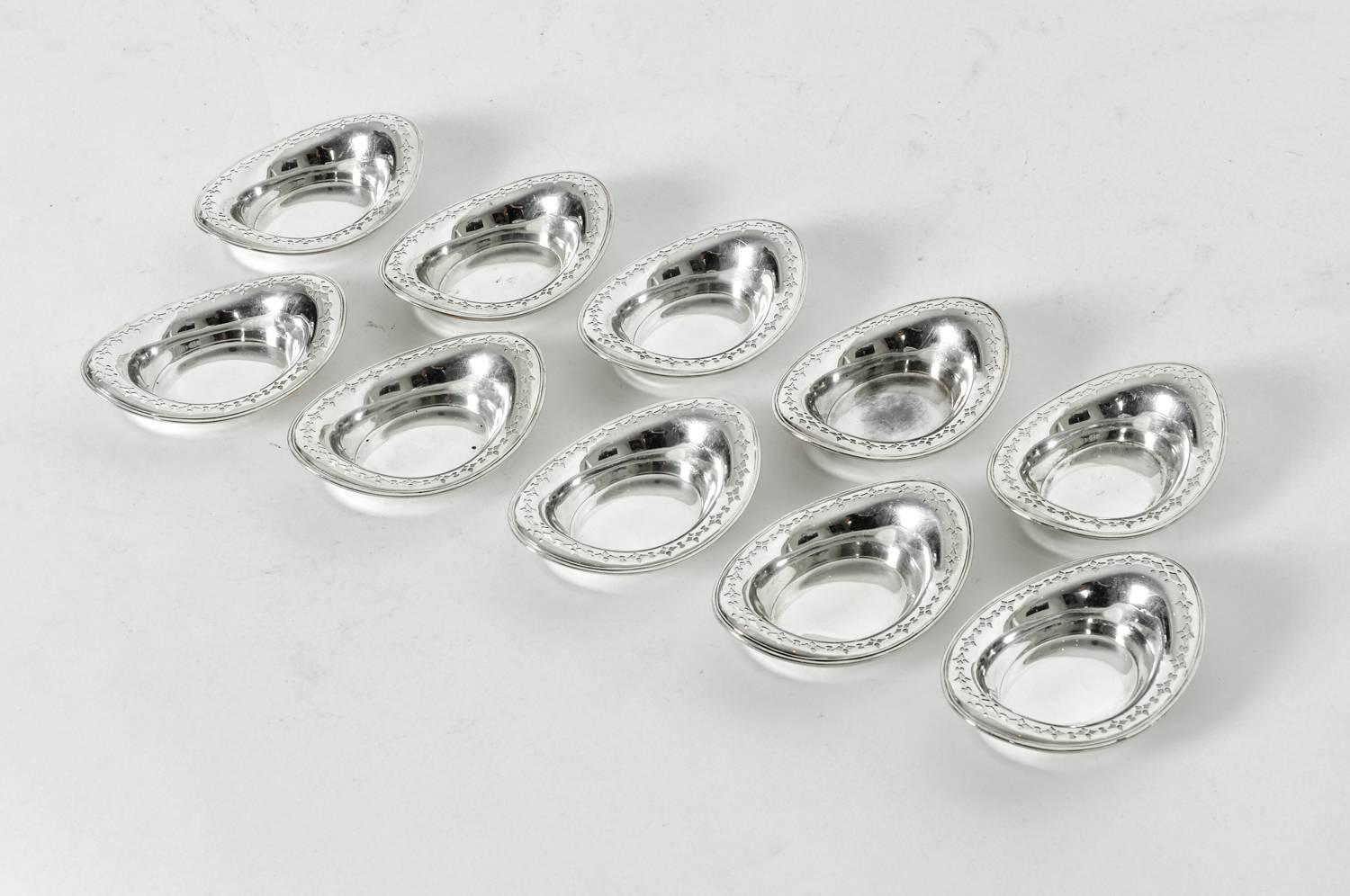 Antique sterling silver Tiffany table condiments / nut disk set of ten pieces. All in excellent condition. Each piece measure 4 inches long X 2.7 inches width.