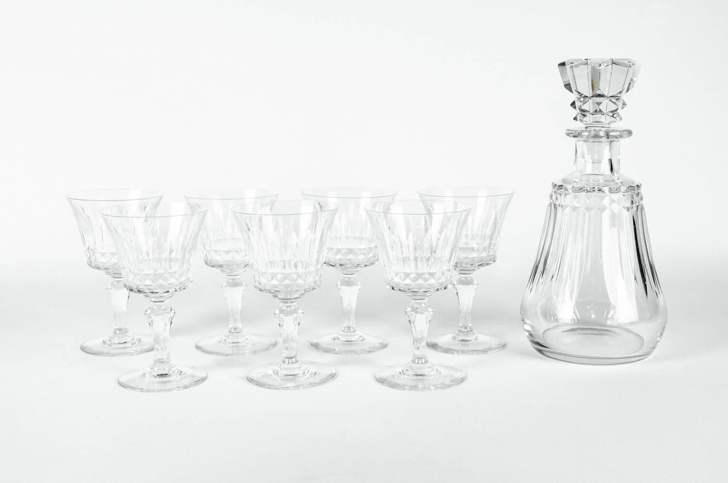 Vintage Baccarat crystal eight pieces decanter set. Each piece is in excellent condition , maker's mark undersigned in each piece. The decanter measure 10 inches high X 5 inches diameter. Each glass measure 5.5 inches high X 3.5 inches diameter.