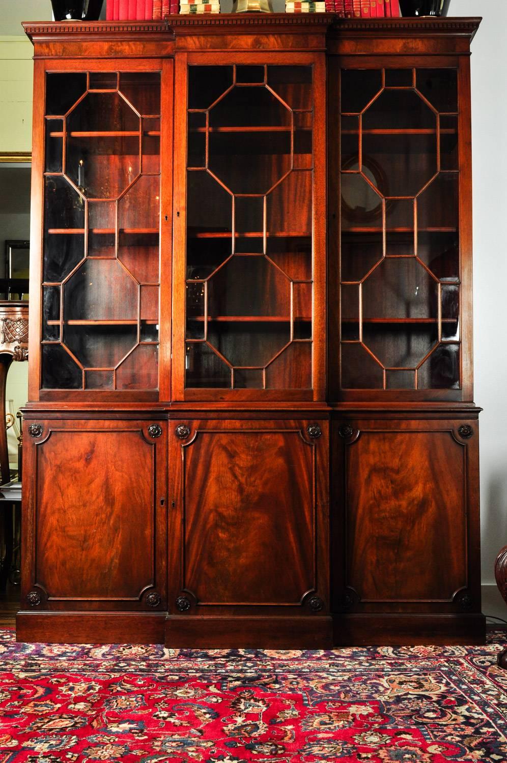 Late 18th-early 19th century mahogany wood American two pieces china cabinet / hutch. The piece is in great condition with some age appropriate wear. The hutch measures 79 inches high x 58 inches wide x 12 inches deep.
    