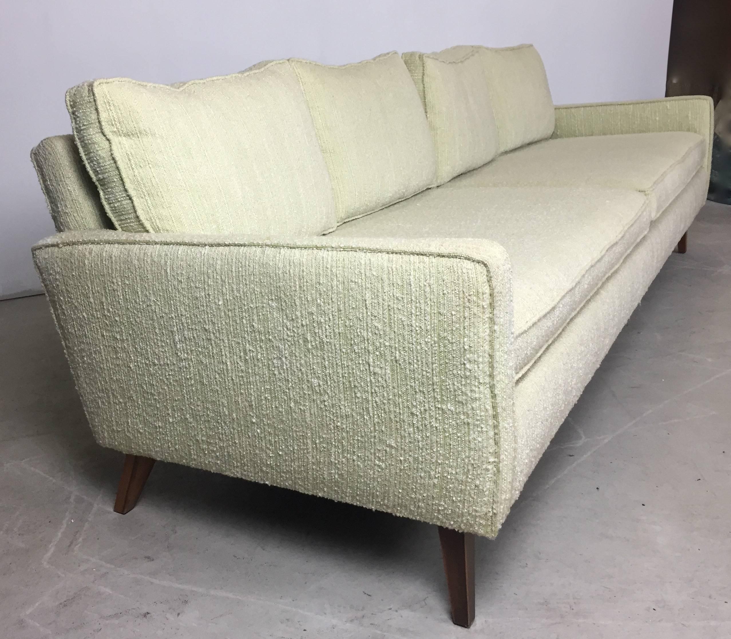 Beautiful 1950s celery wool boucle and walnut sofa and chair set in excellent original condition.

The sofa measures 92