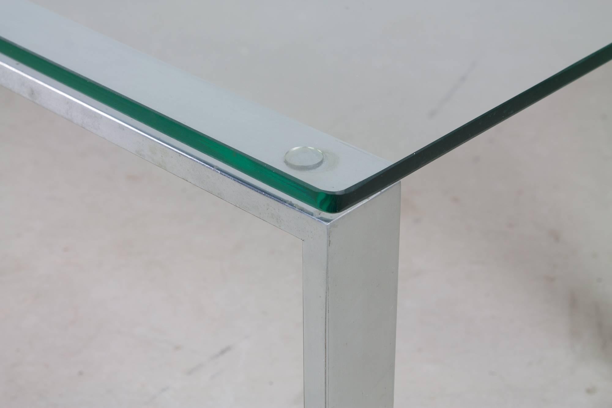 Strikingly Minimalist chrome and glass cocktail table by Pace Collection with sled base and rectangular glass top.