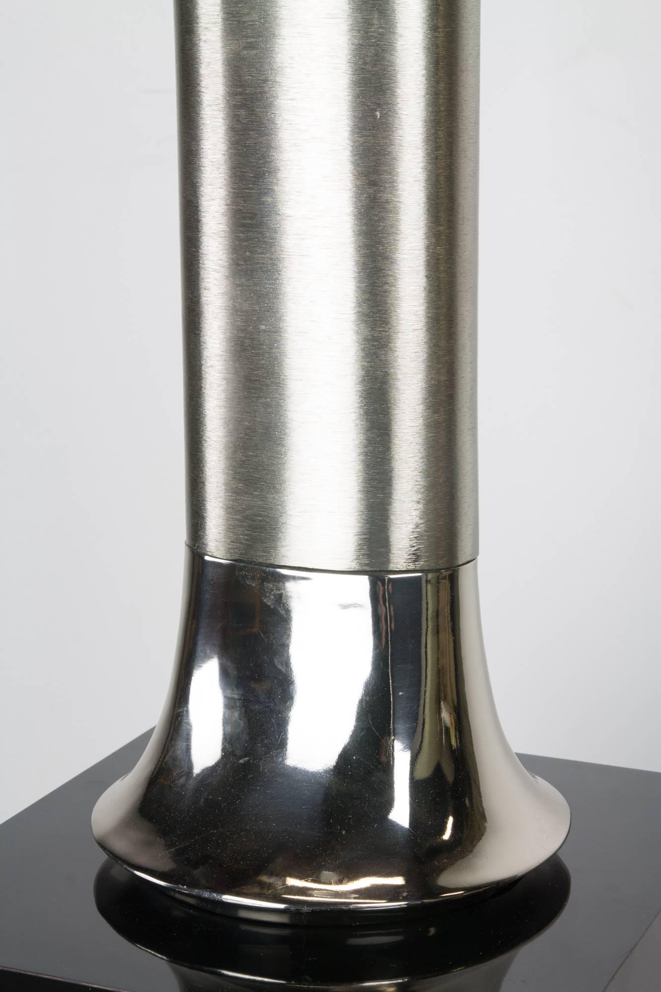 A rare table lamp by Laurel with a subtle tulip form at the chrome base, rising into a body of brushed aluminium.