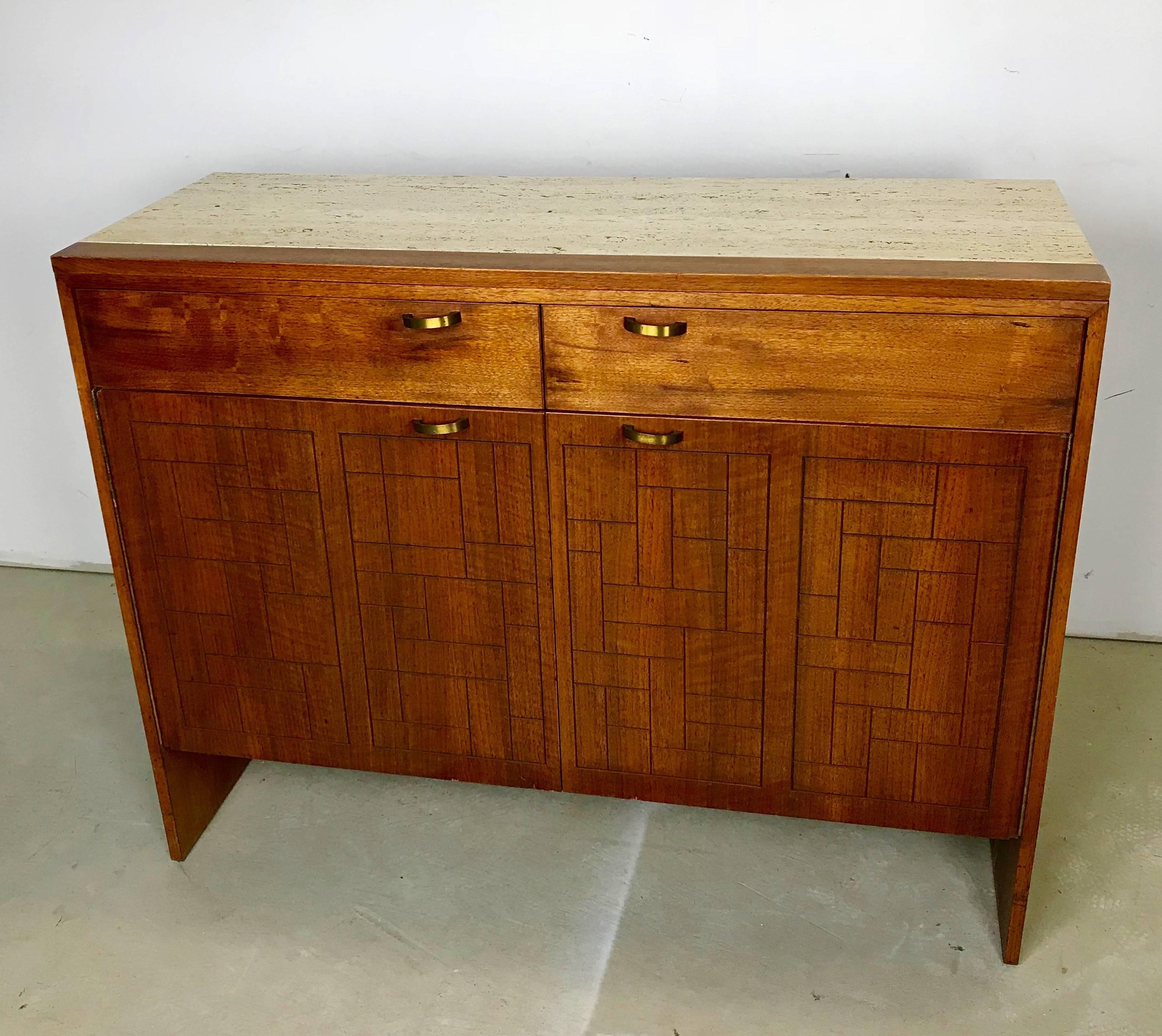 This is a custom design cabinet. It was custom-made and purchased by us from the original owner. The cabinet is beautifully crafted from American walnut, with a travertine marble top and brass hardware. The doors have a wonderful graphic pattern