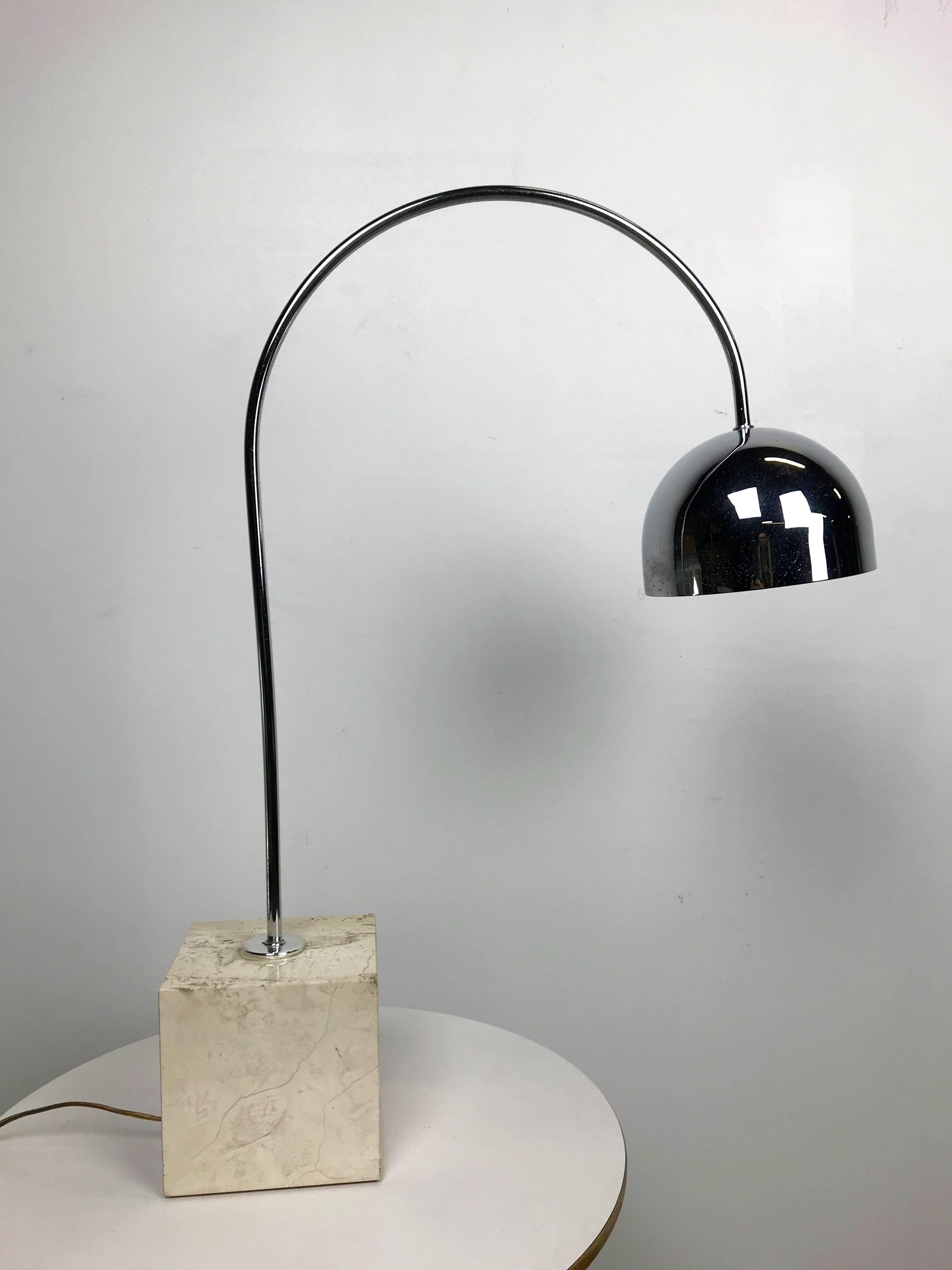 Here is a wonderfully minimal Italian travertine marble and chrome table lamp with a Spherical shade. Use it on your desk or as accent lighting. An elegant design from the 1970s.