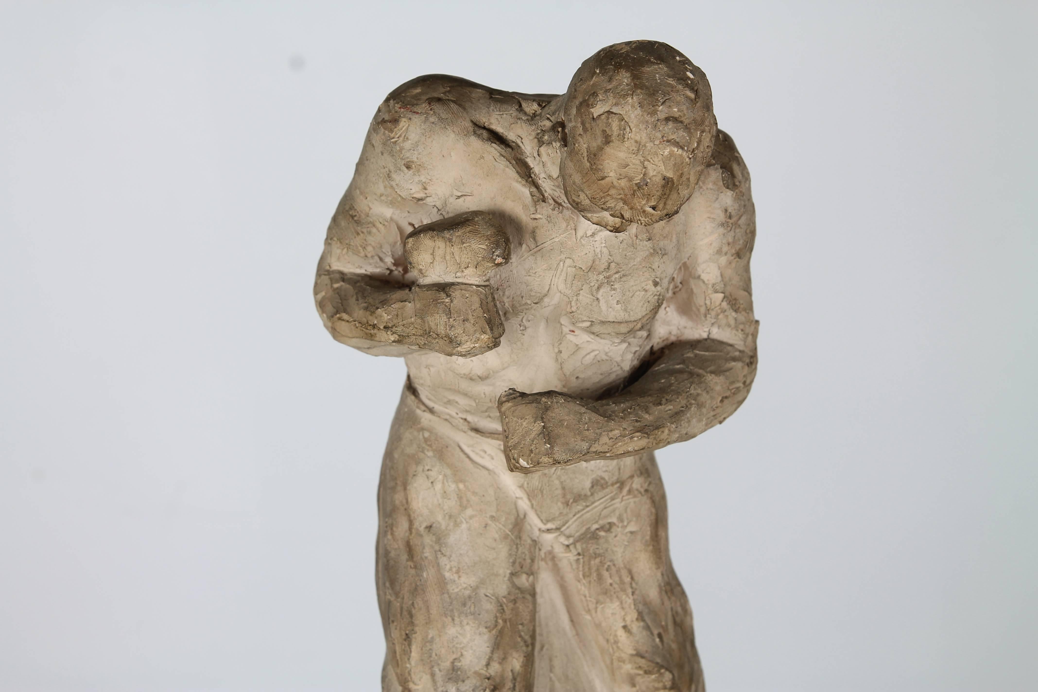 A prototype by Dutch sculptor Wessel Couzyn in plaster depicting a blacksmith with hammer. Signed at base.

Couzyn attended the Dutch Royal Academy of Plastic Arts in the late 1930s and was awarded the Prix de Rome in that time to study in Italy.