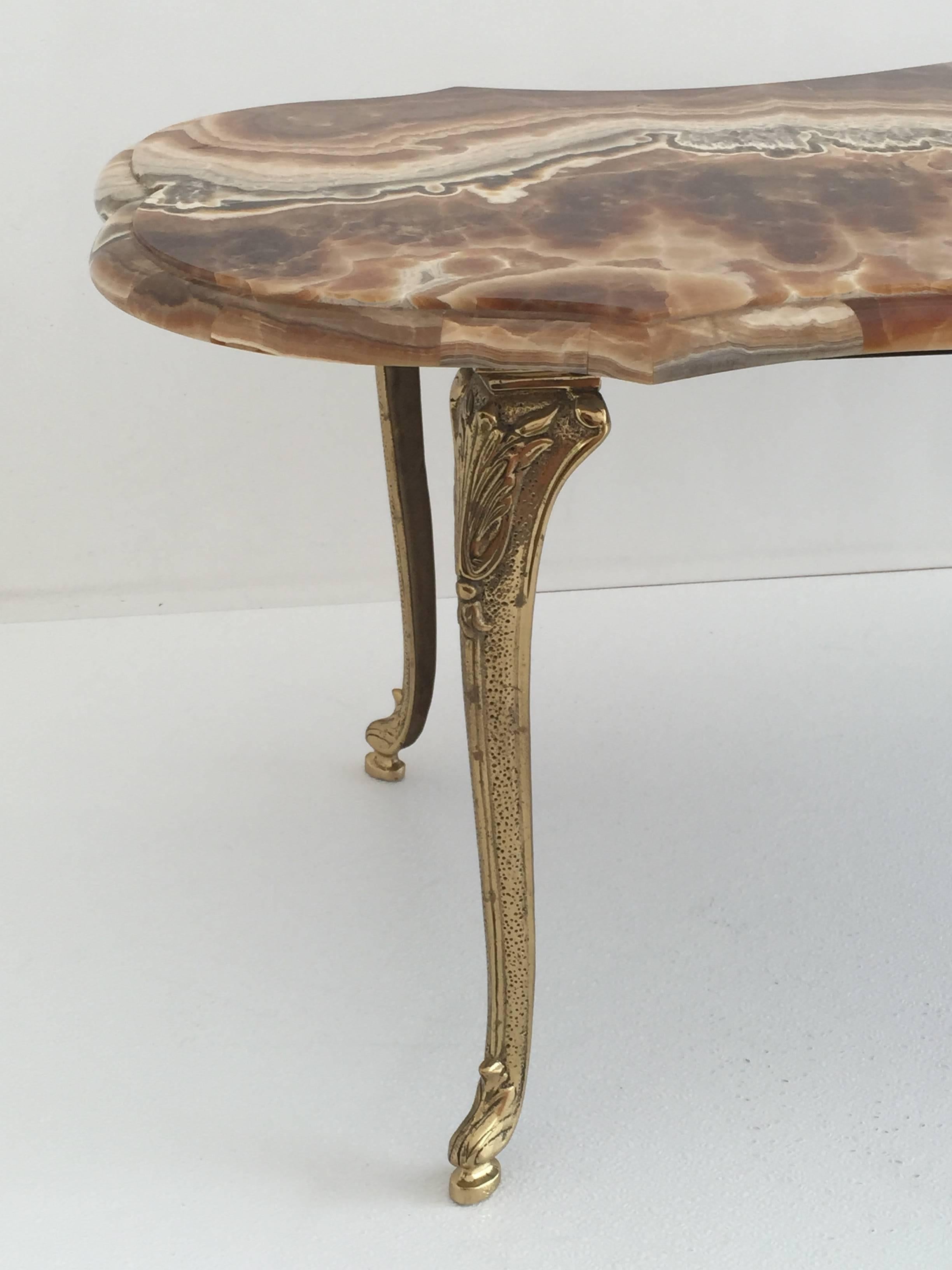 Onyx and brass coffee table.
Offered at Gallery Girasole