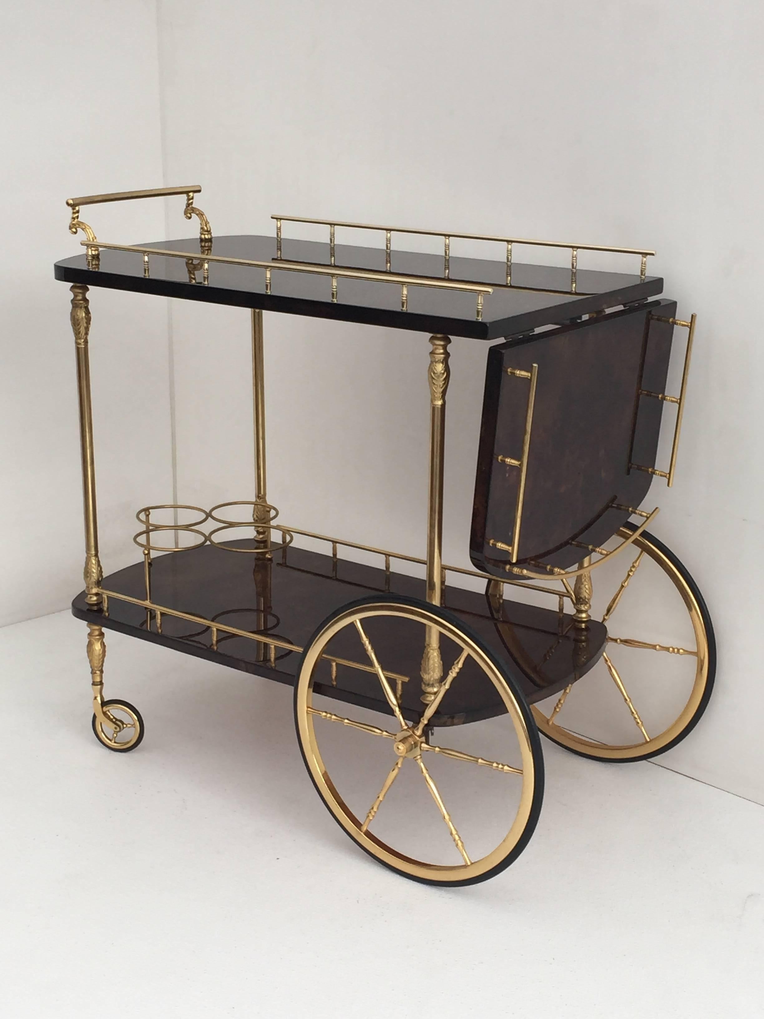 Dark brown parchment Aldo Tura bar cart top in open position is 44" by 17".